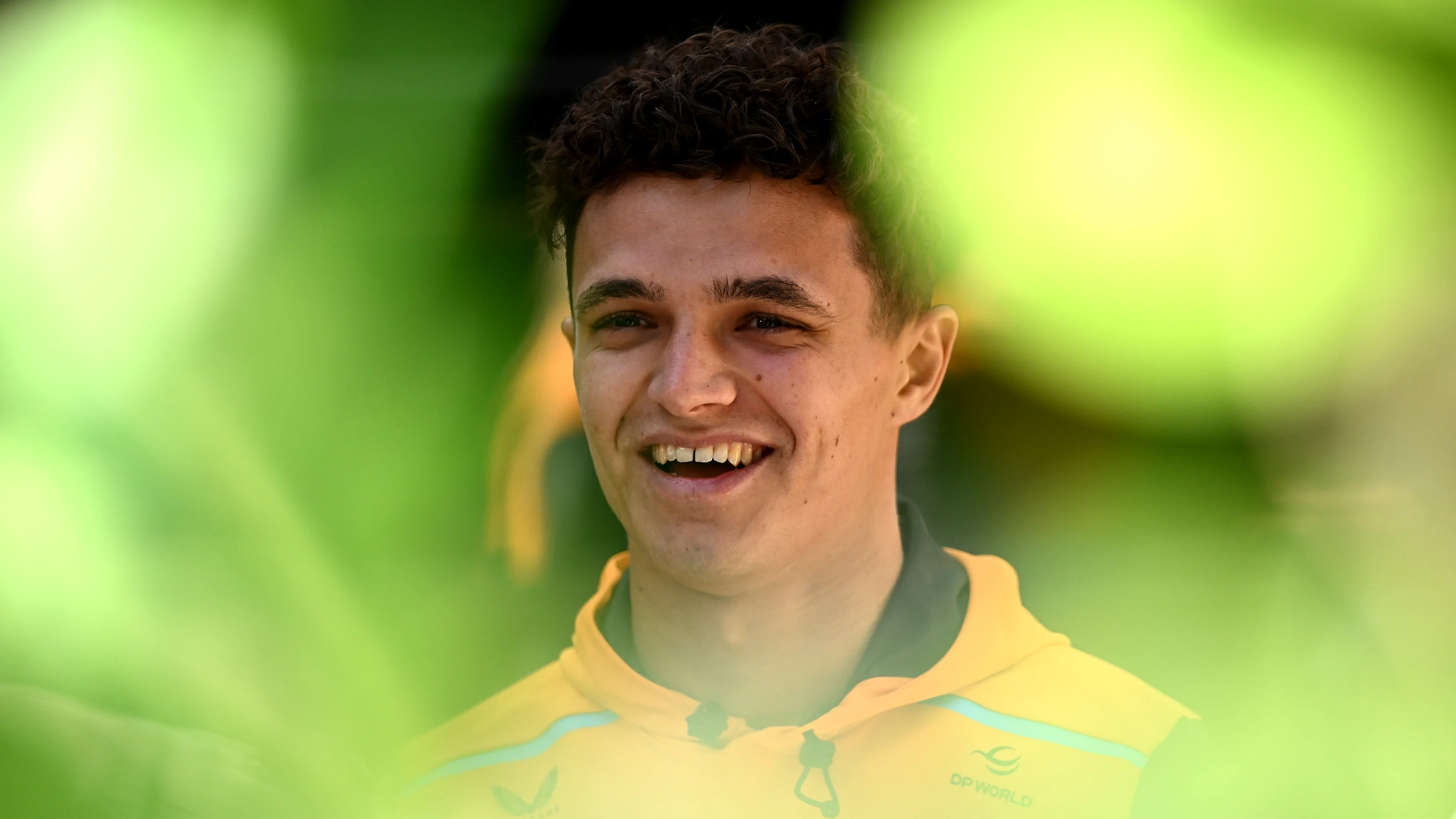 MELBOURNE, AUSTRALIA - MARCH 21: Lando Norris of Great Britain and McLaren looks on in the Paddock