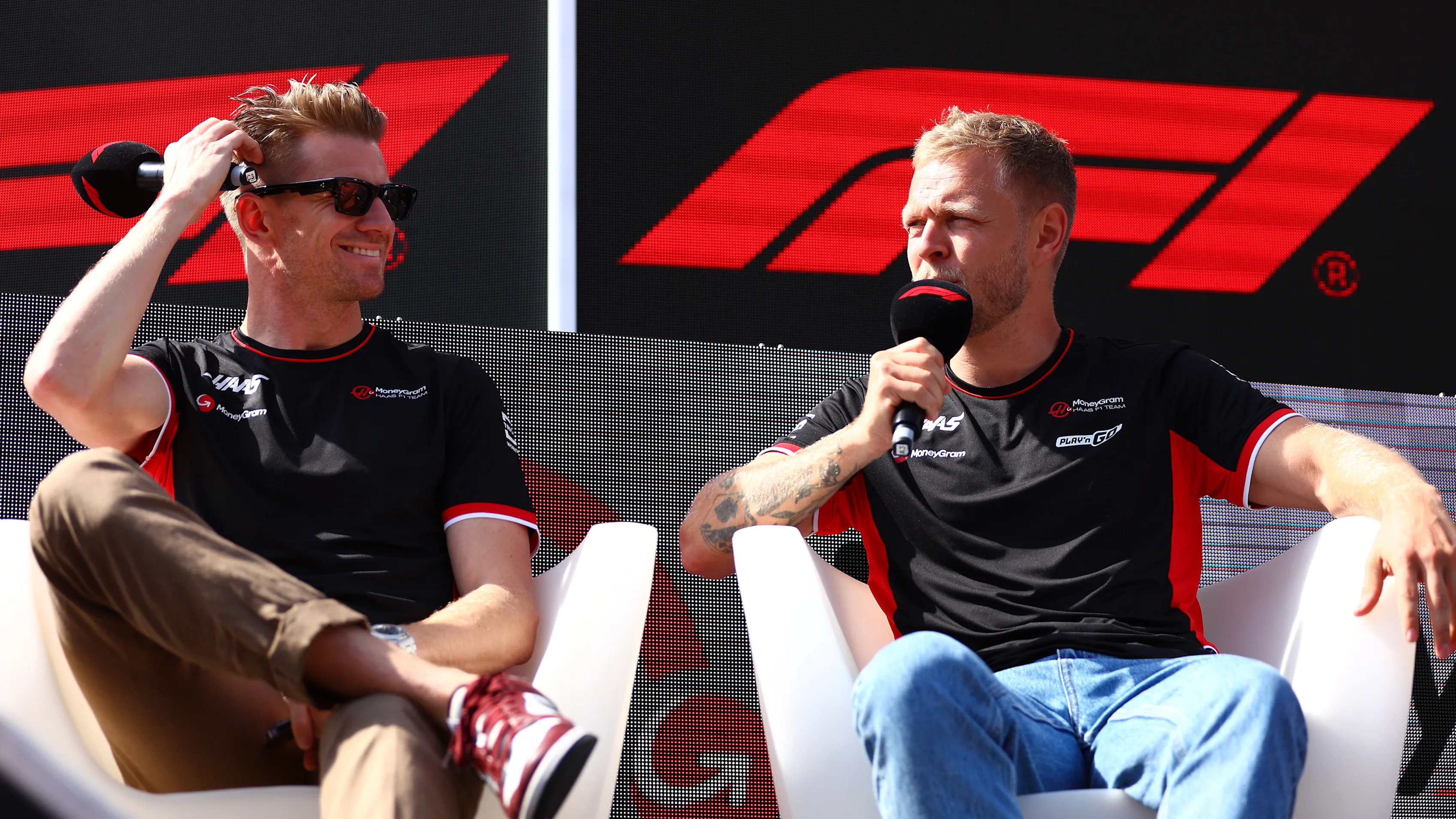 SPIELBERG, AUSTRIA - JUNE 29: Nico Hulkenberg of Germany and Haas F1 and Kevin Magnussen of Denmark