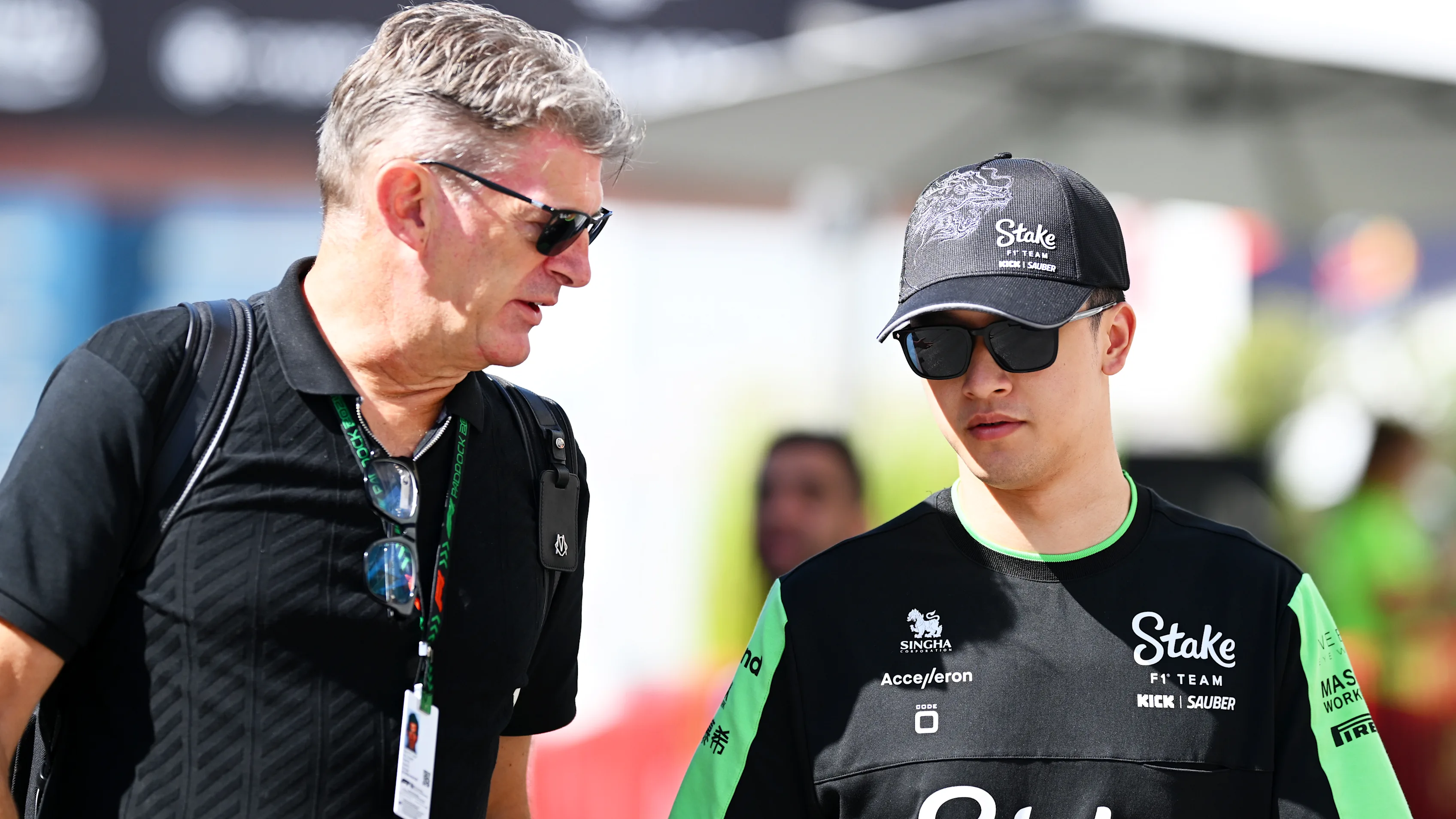 BAKU, AZERBAIJAN - SEPTEMBER 15: Zhou Guanyu of China and Stake F1 Team Kick Sauber talks with