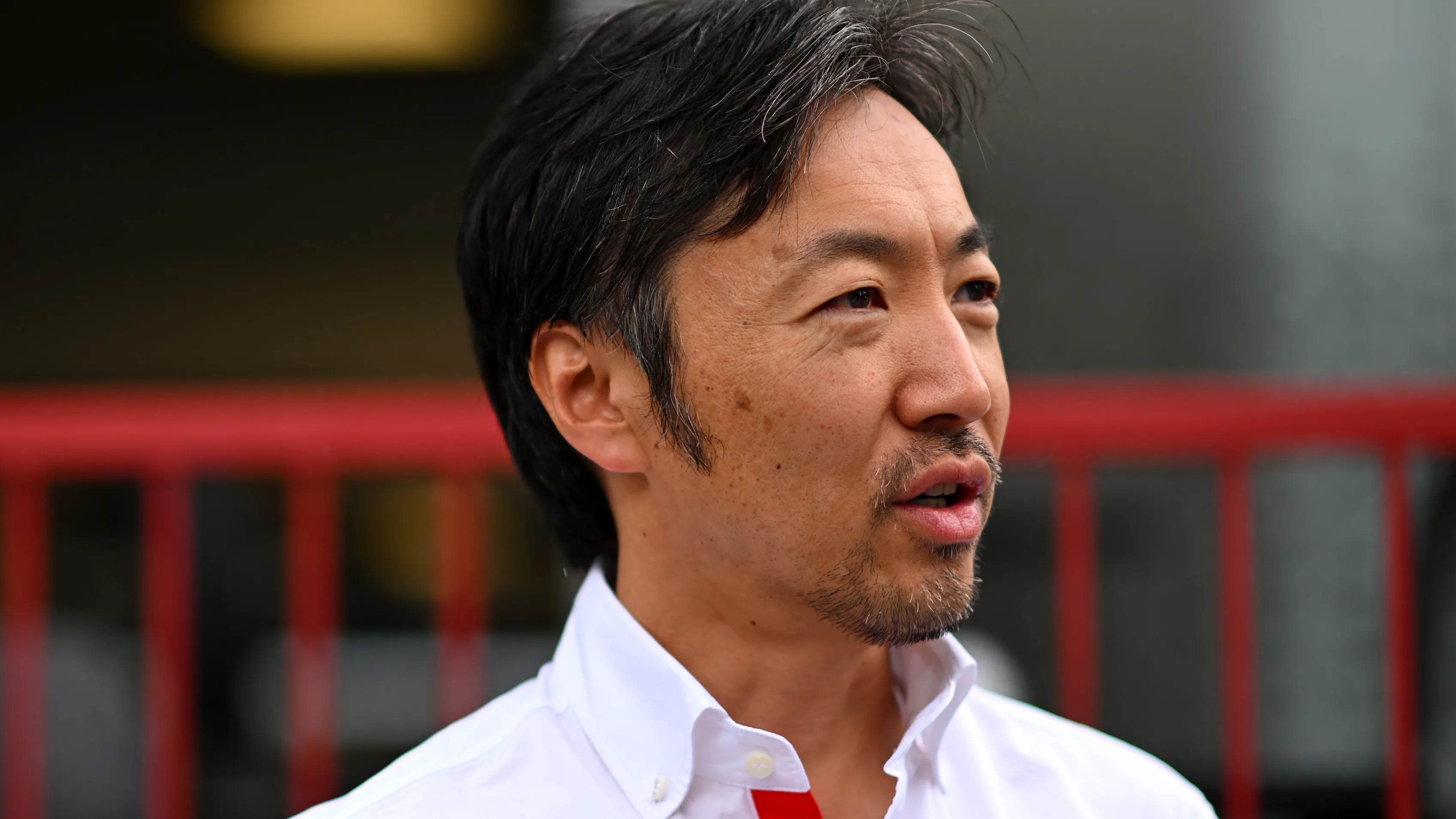 BAKU, AZERBAIJAN - SEPTEMBER 14: Haas F1 Team Principal Ayao Komatsu looks on in the Paddock prior
