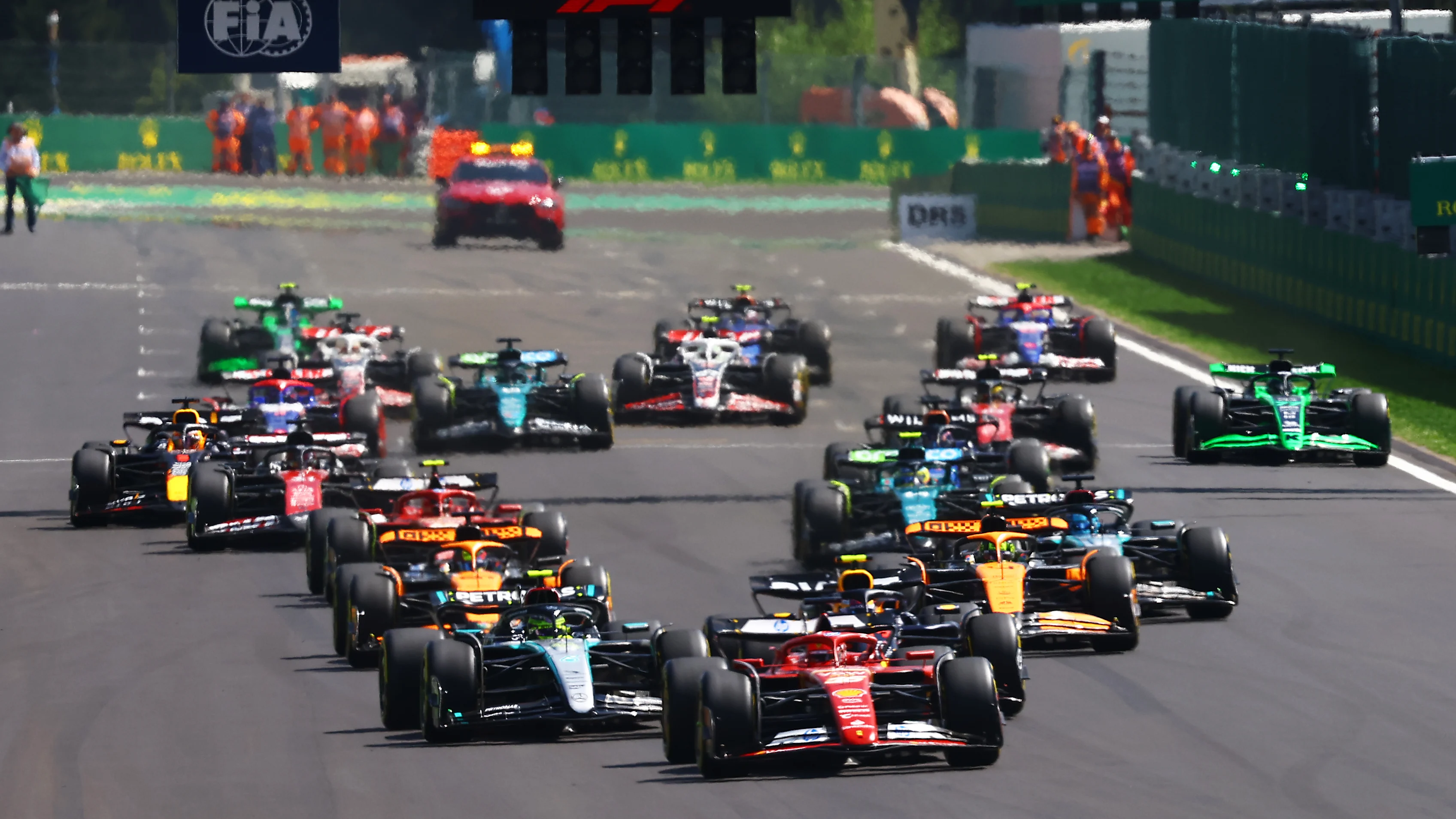 SPA, BELGIUM - JULY 28: Charles Leclerc of Monaco driving the (16) Ferrari SF-24 leads the field