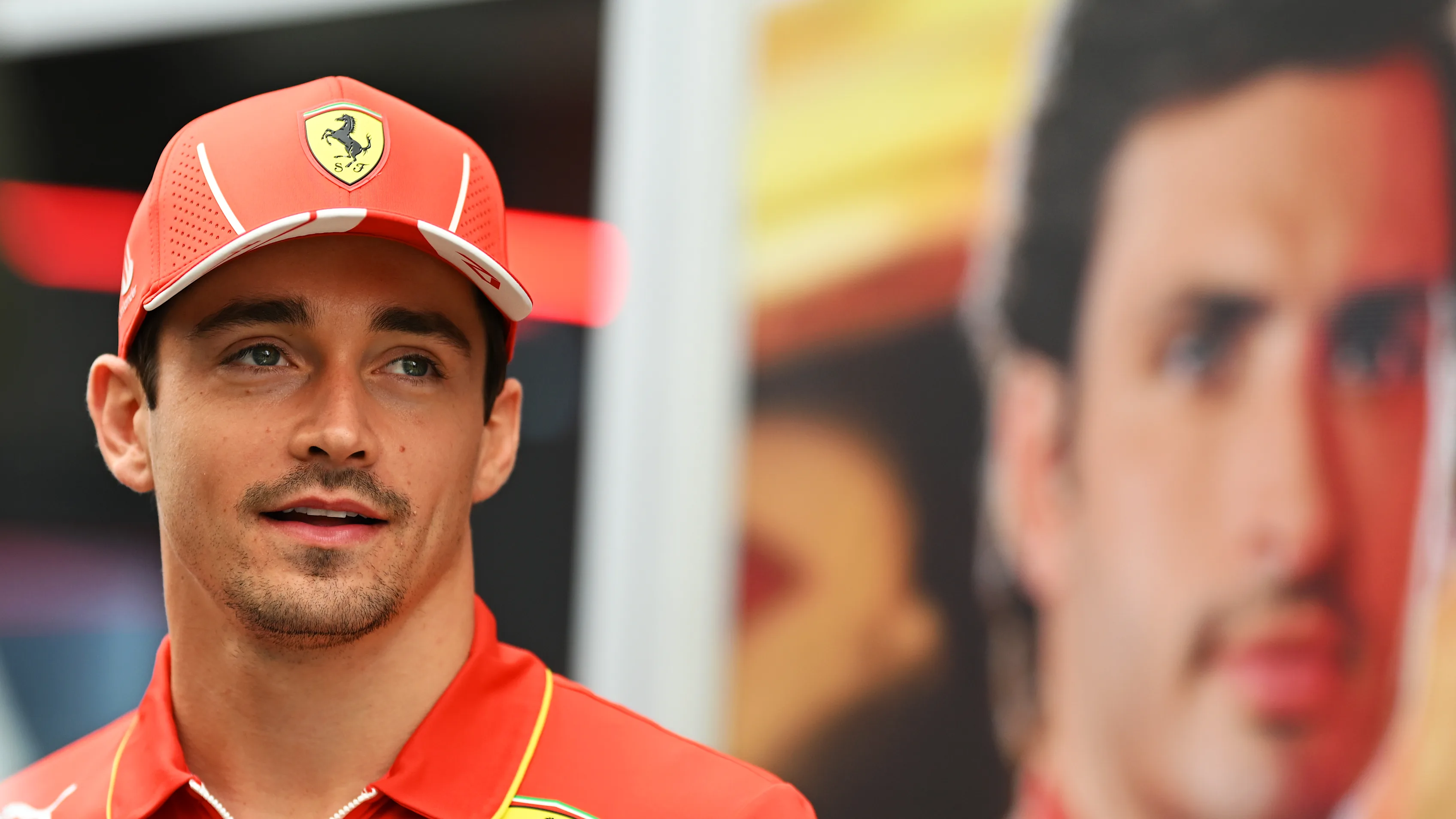 SAO PAULO, BRAZIL - OCTOBER 31: Charles Leclerc of Monaco and Ferrari looks on in the Paddock
