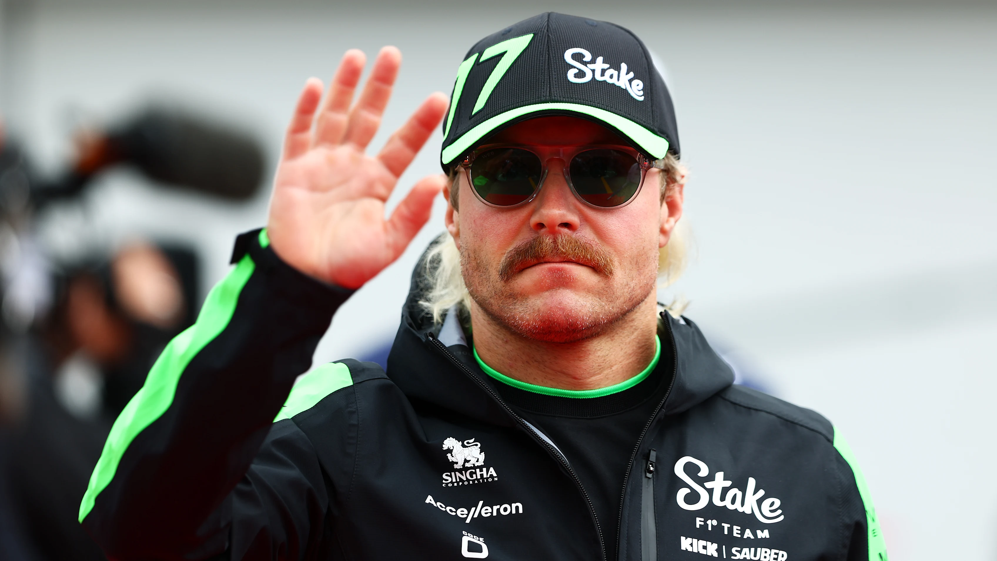 MONTREAL, QUEBEC - JUNE 09: Valtteri Bottas of Finland and Stake F1 Team Kick Sauber waves to the
