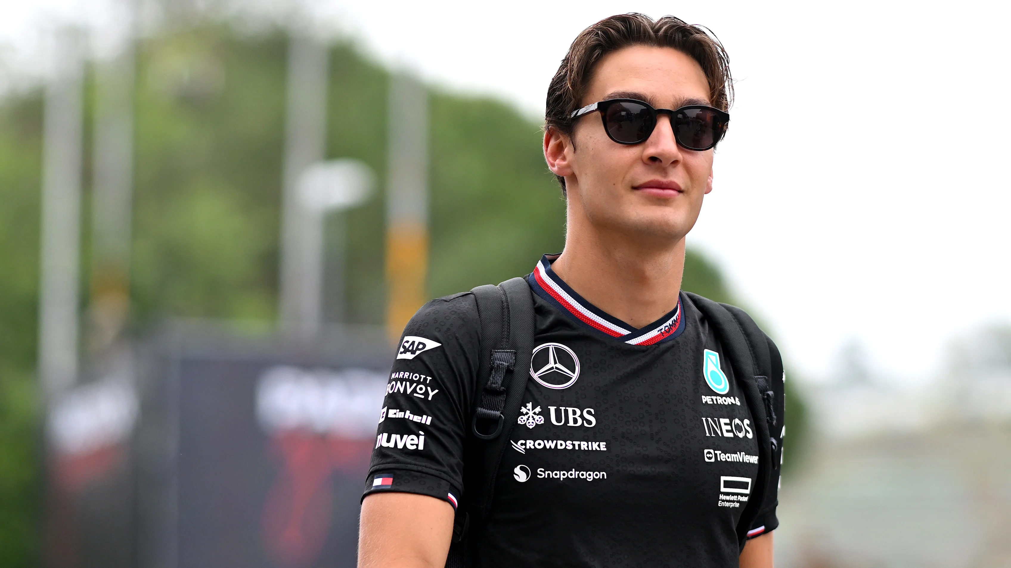 IMOLA, ITALY - MAY 16: George Russell of Great Britain and Mercedes walks in the Paddock during
