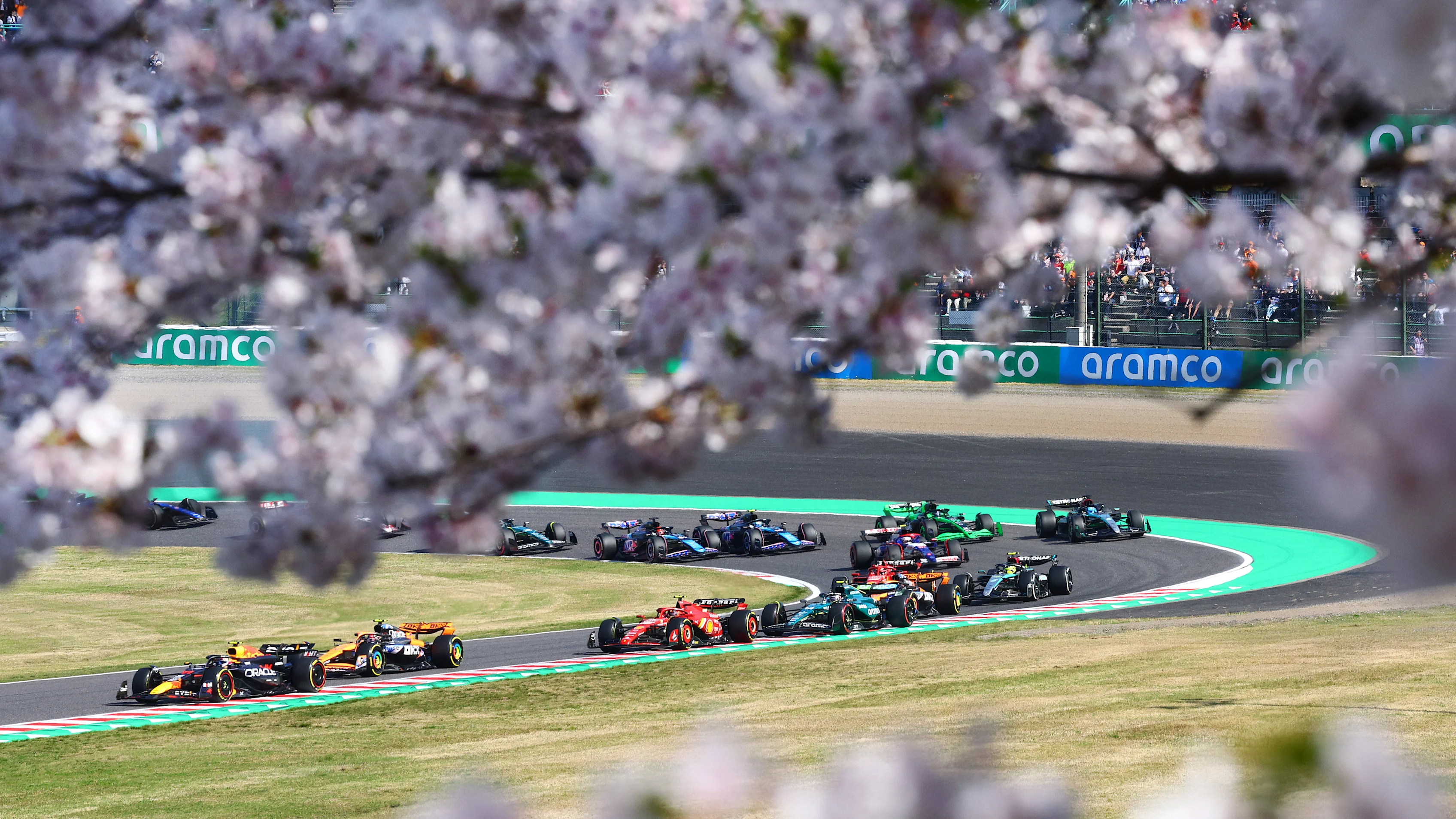 SUZUKA, JAPAN - APRIL 07: Sergio Perez of Mexico driving the (11) Oracle Red Bull Racing RB20 leads
