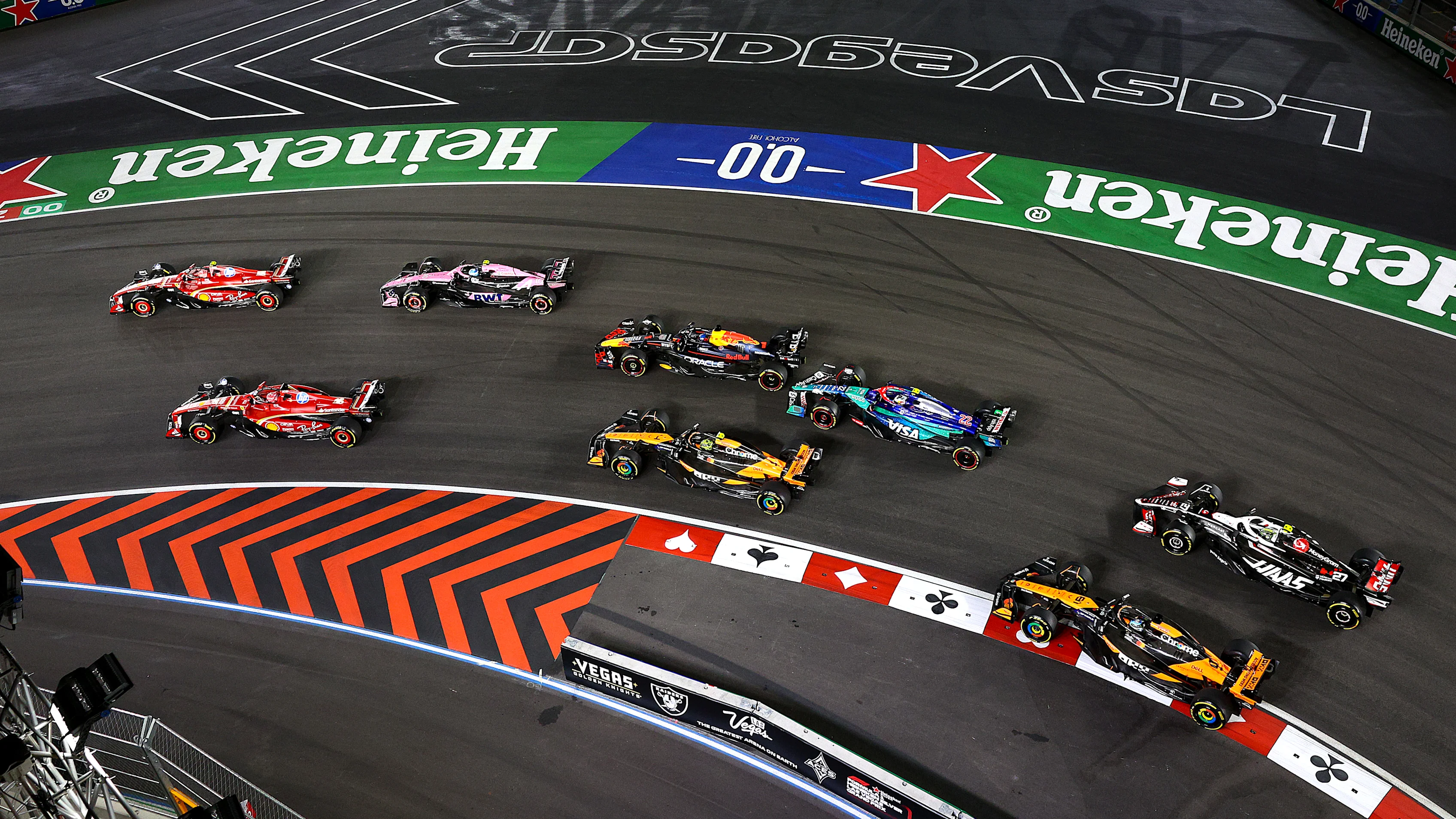 LAS VEGAS, NEVADA - NOVEMBER 23: Carlos Sainz of Spain driving (55) the Ferrari SF-24 leads Charles