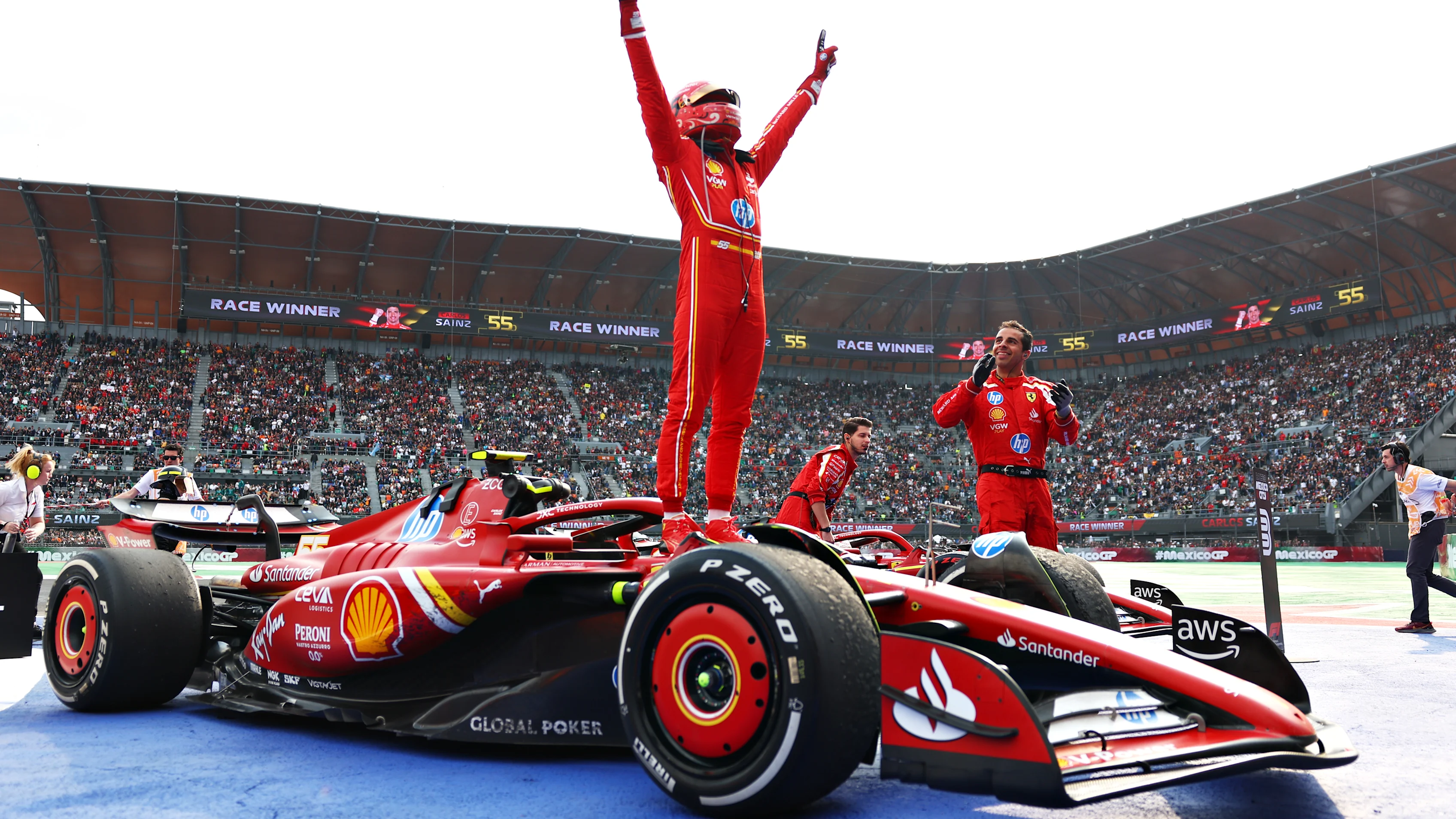 MEXICO CITY, MEXICO - OCTOBER 27: Race winner Carlos Sainz of Spain and Ferrari celebrates in parc