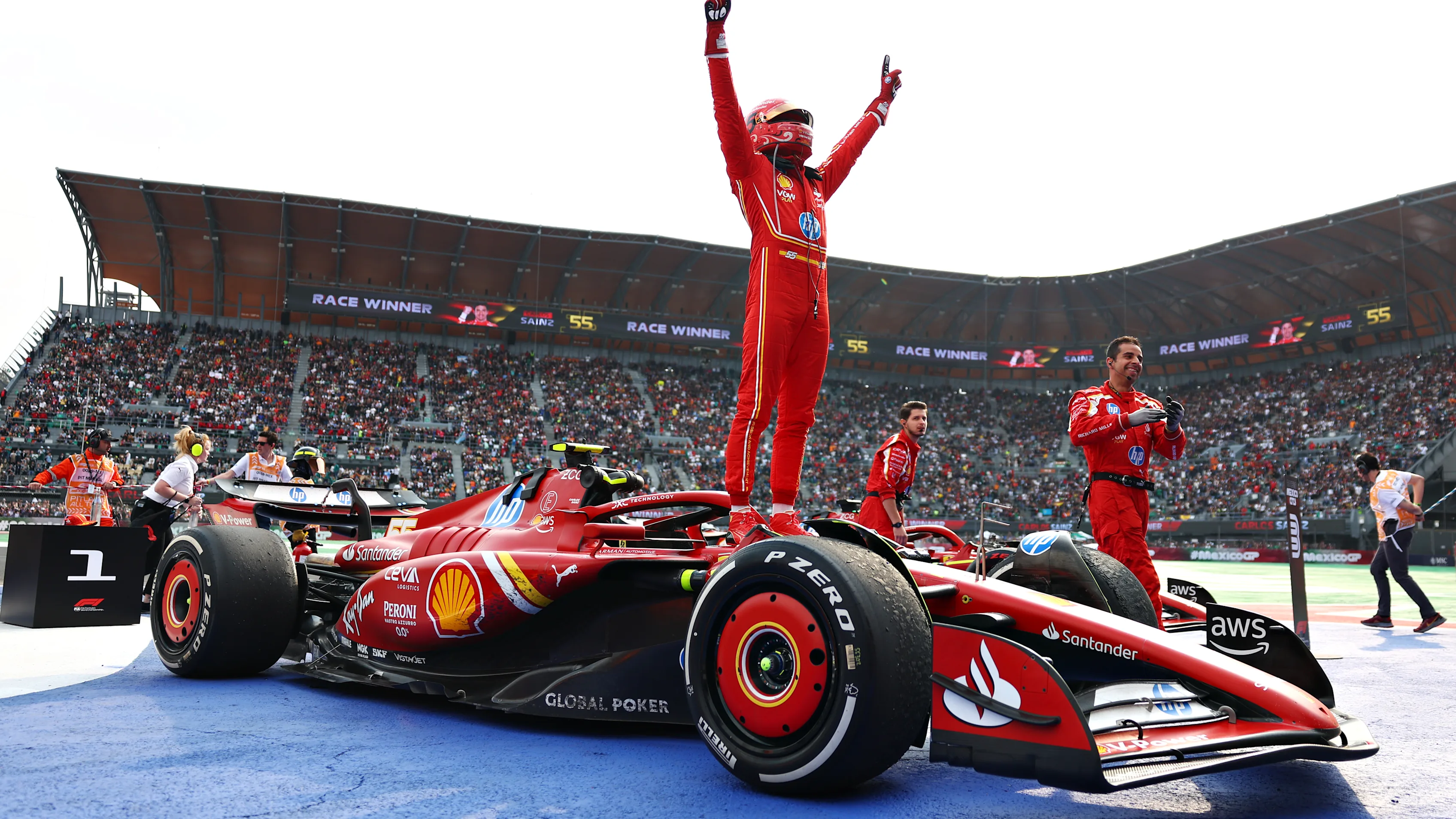 MEXICO CITY, MEXICO - OCTOBER 27: Race winner Carlos Sainz of Spain and Ferrari celebrates in parc