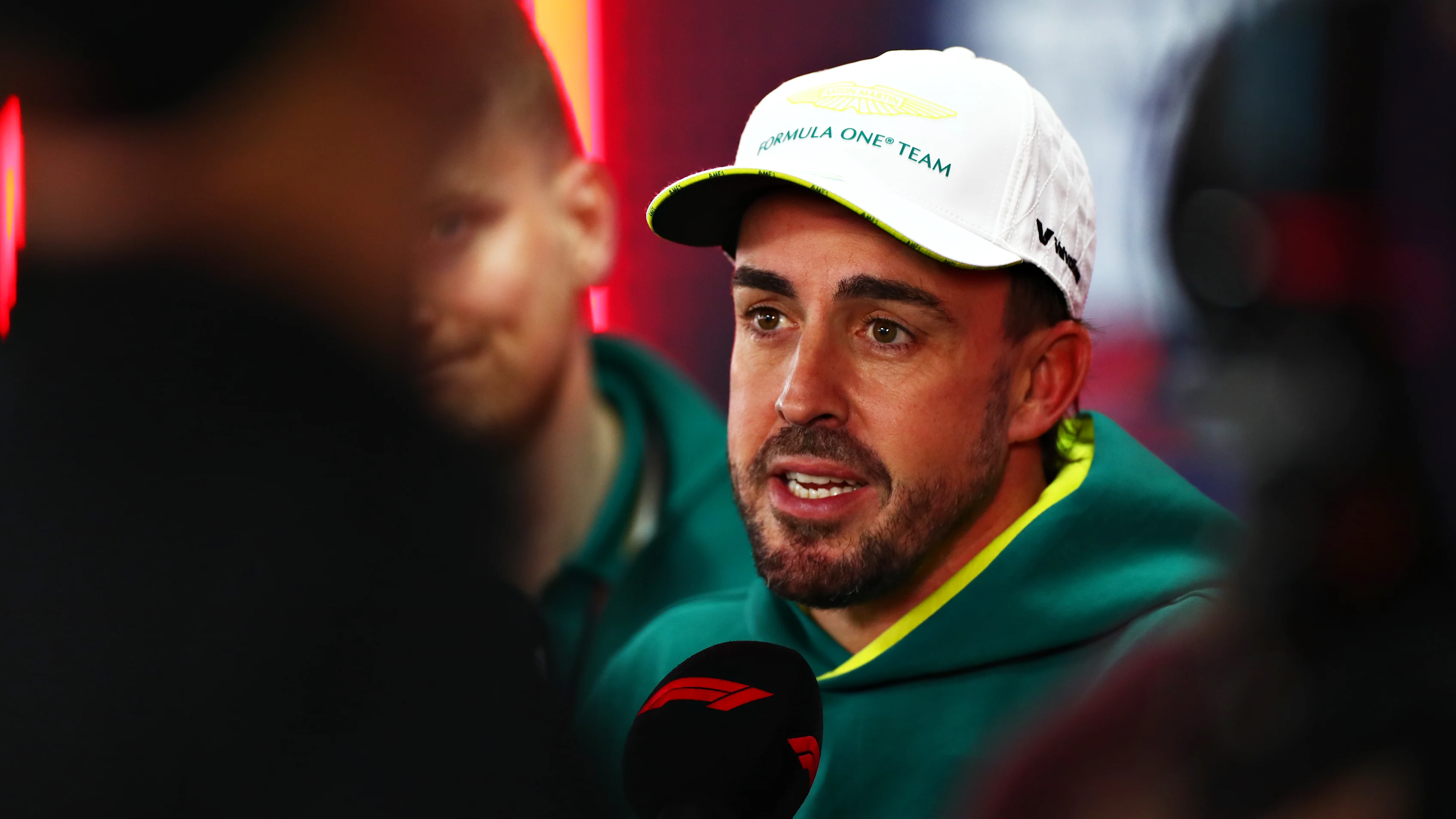 MEXICO CITY, MEXICO - OCTOBER 25: Fernando Alonso of Spain and Aston Martin F1 Team talks to the