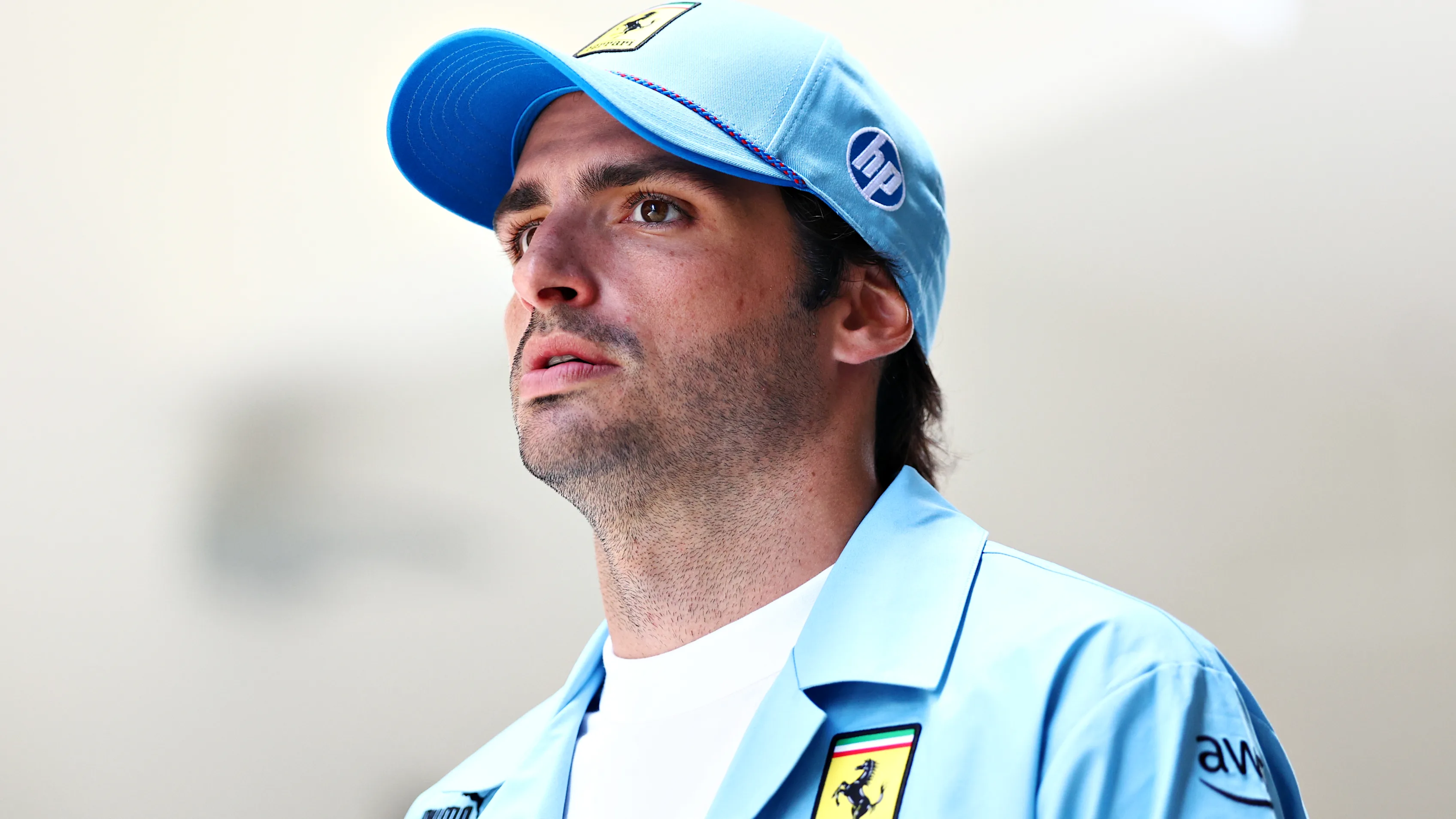 MIAMI, FLORIDA - MAY 05: Carlos Sainz of Spain and Ferrari walks in the Paddock prior to the F1