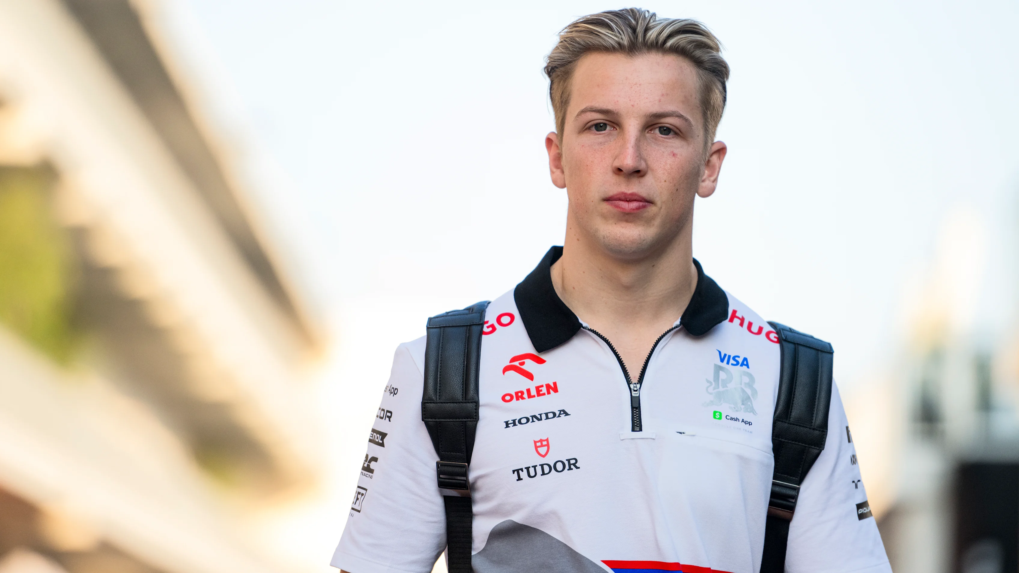 AUSTIN, TEXAS - OCTOBER 17: Liam Lawson of New Zealand and Visa Cash App RB walks in the Paddock