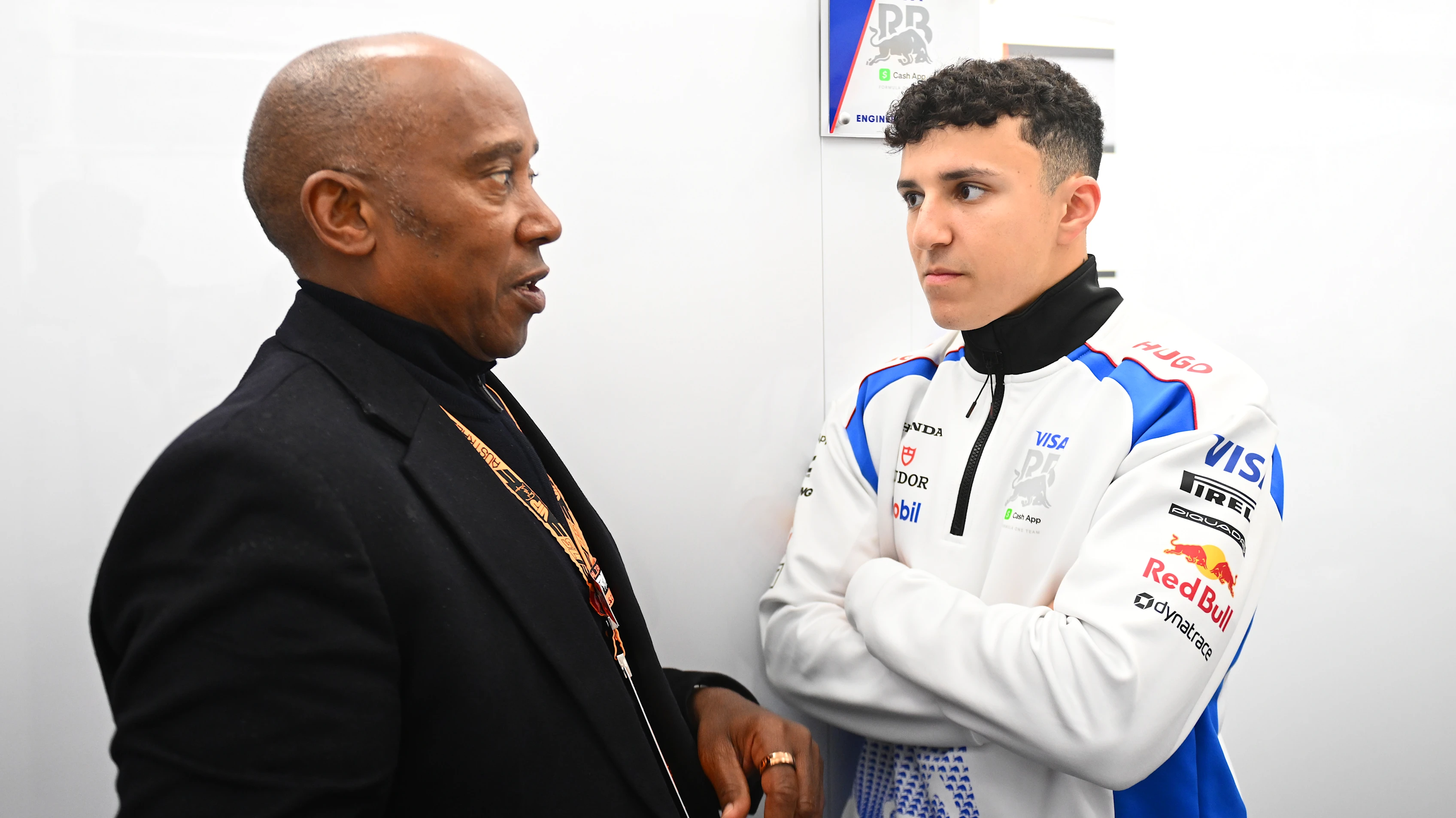 MELBOURNE, AUSTRALIA - MARCH 16: Anthony Hamilton with Isack Hadjar of France and Visa Cash App