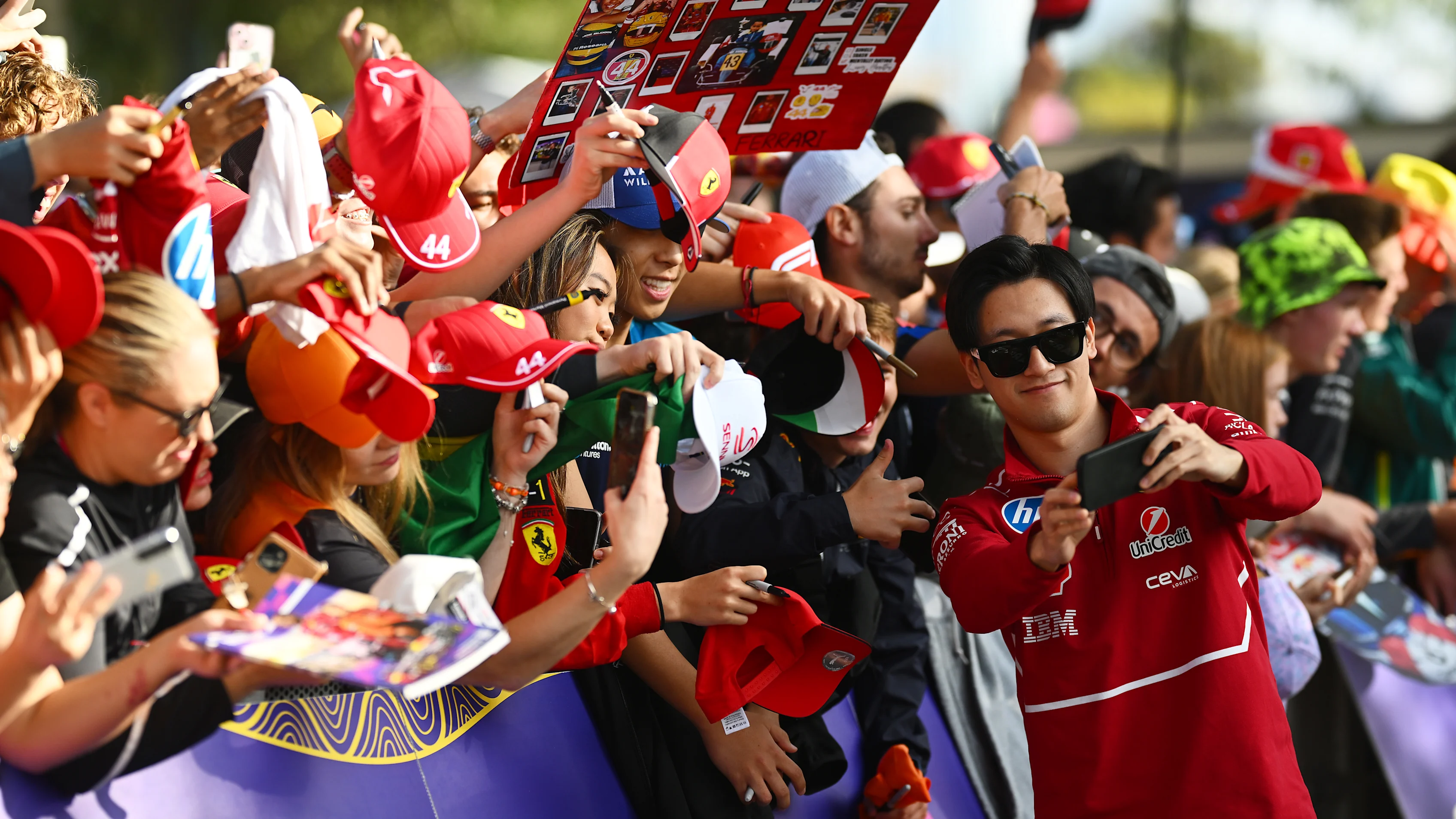 MELBOURNE, AUSTRALIA - MARCH 14: Zhou Guanyu of China and Scuderia Ferrari meets some fans prior to