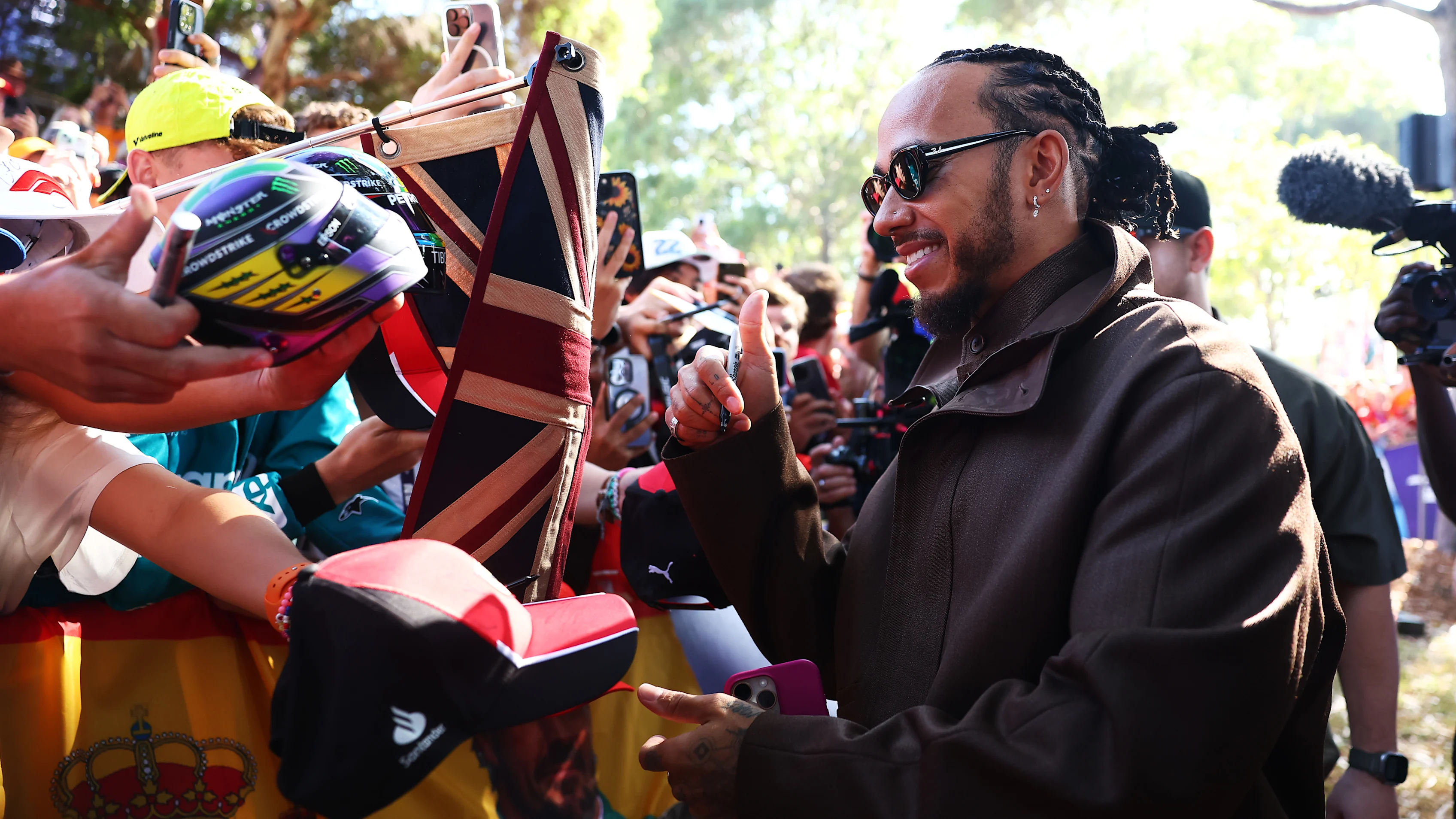 Lewis was all smiles with fans in Australia at the start of the season