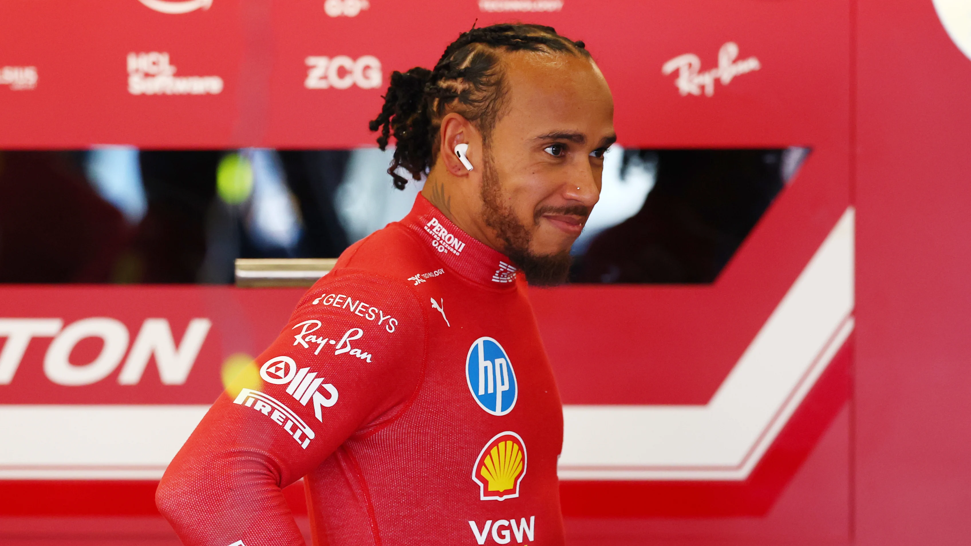 MELBOURNE, AUSTRALIA - MARCH 14: Lewis Hamilton of Great Britain and Scuderia Ferrari looks on in