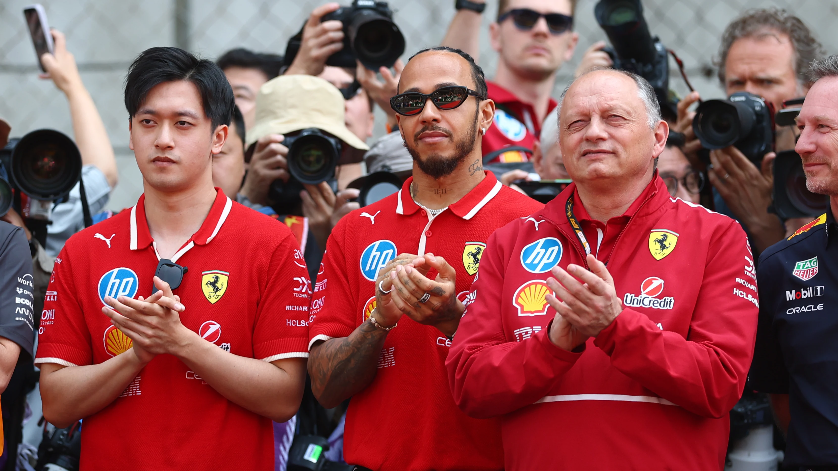 SHANGHAI, CHINA - MARCH 23: Zhou Guanyu of China and Scuderia Ferrari, Lewis Hamilton of Great