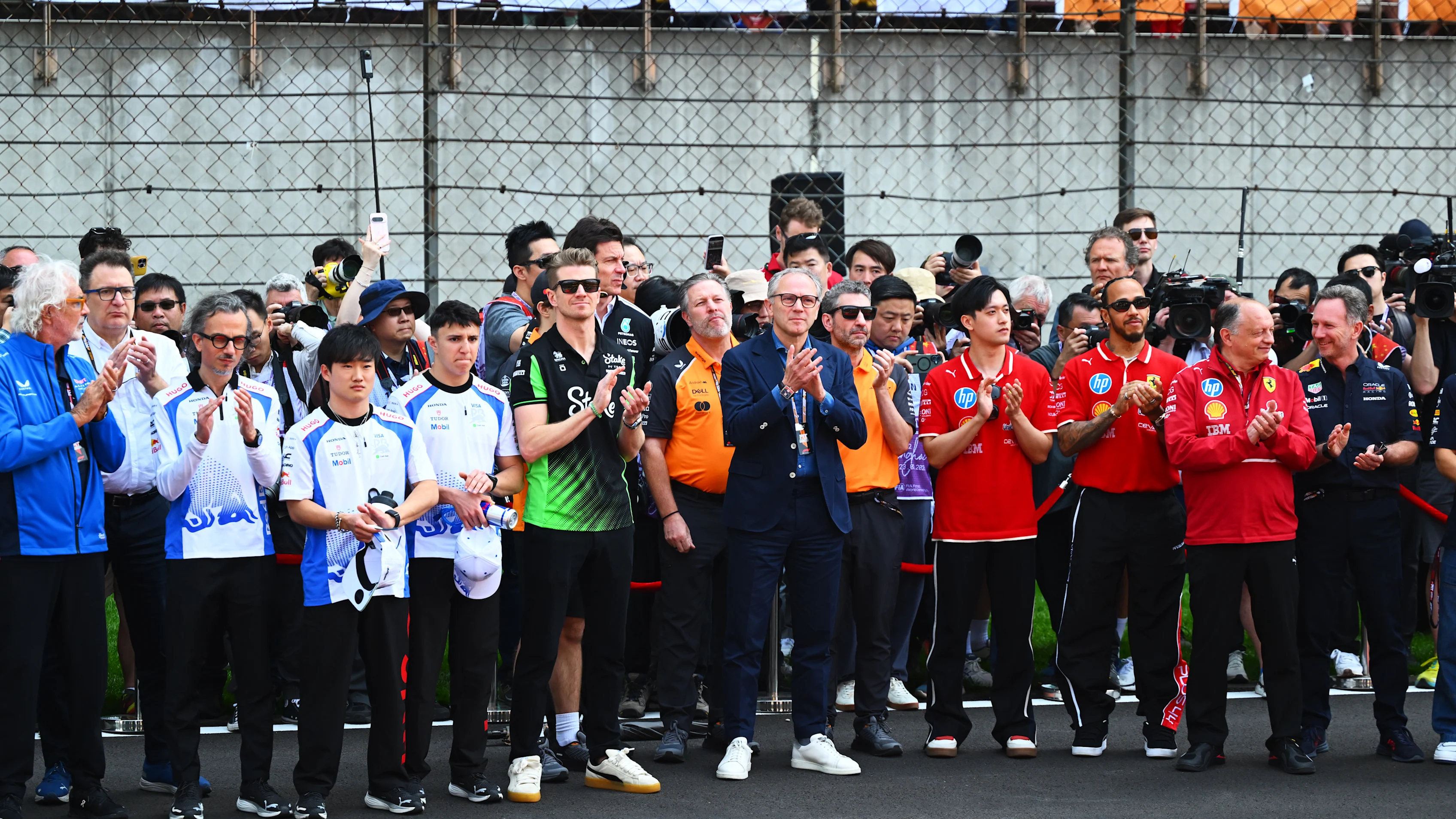 SHANGHAI, CHINA - MARCH 23: Drivers and team personnel gather for a tribute to the late Eddie