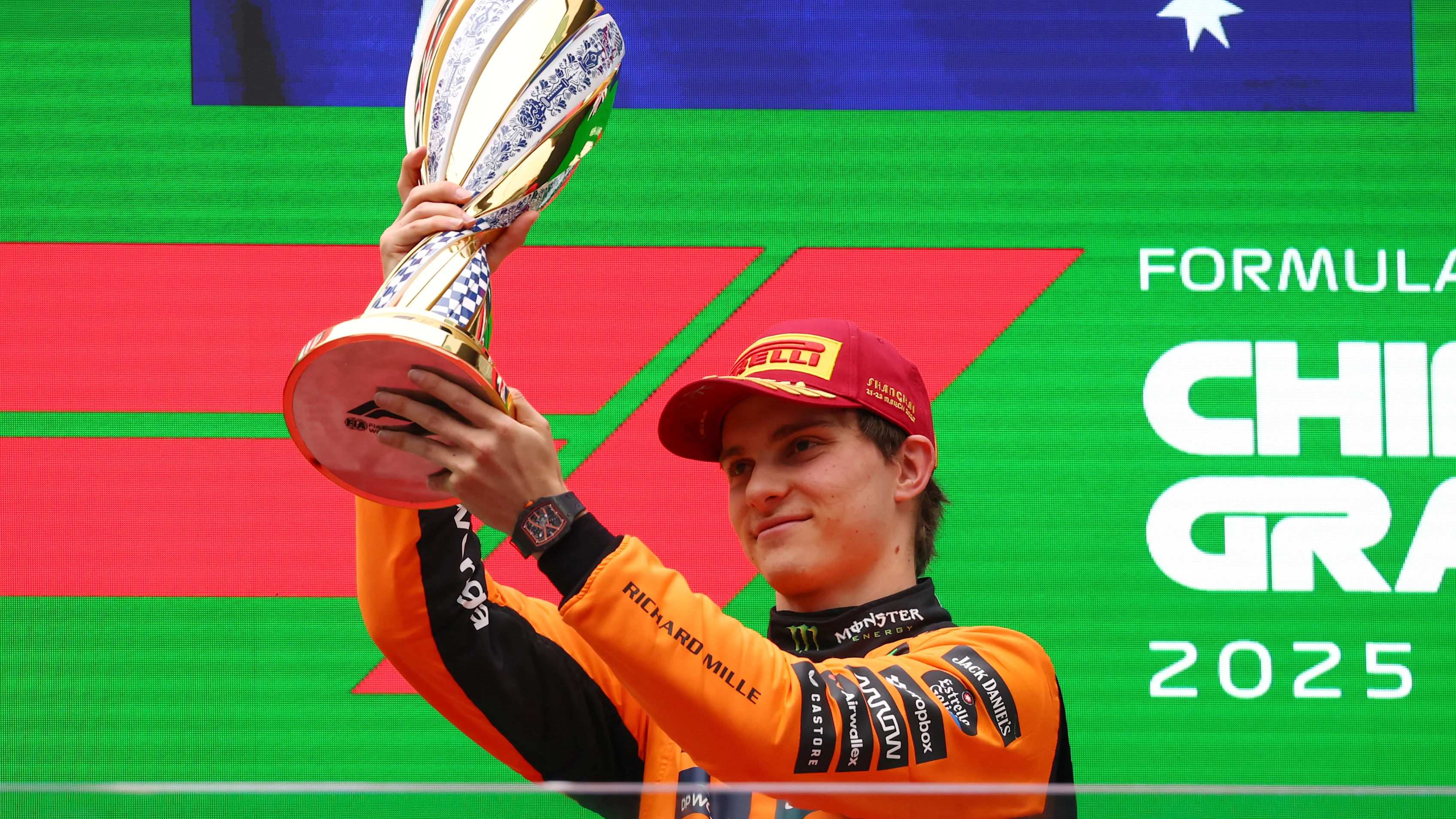 SHANGHAI, CHINA - MARCH 23: Race winner Lando Norris of Great Britain and McLaren lifts his trophy