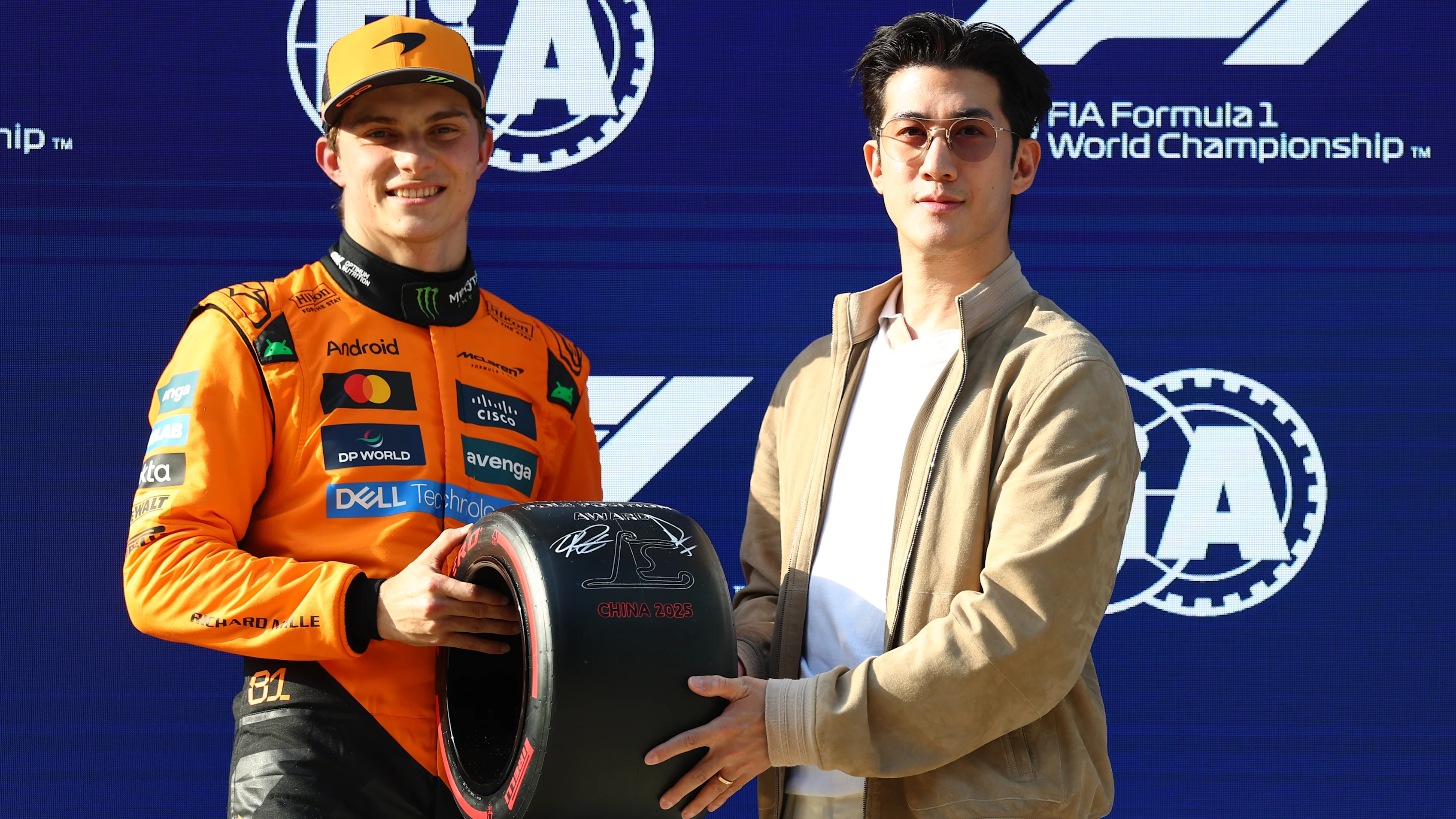 SHANGHAI, CHINA - MARCH 22: Pole position qualifier Oscar Piastri of Australia and McLaren receives