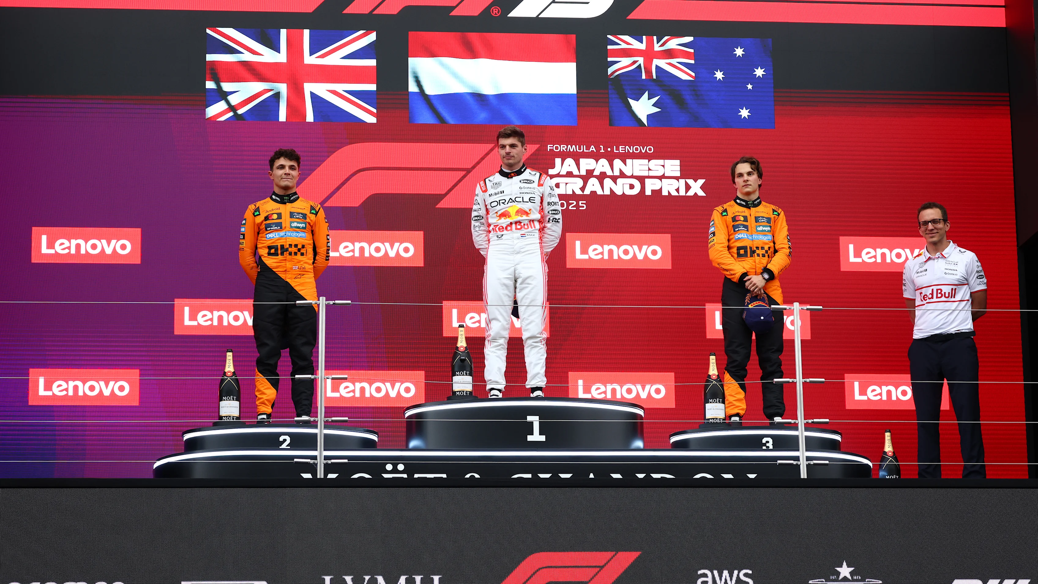 SUZUKA, JAPAN - APRIL 06: Second placed Lando Norris of Great Britain and McLaren Race winner Max