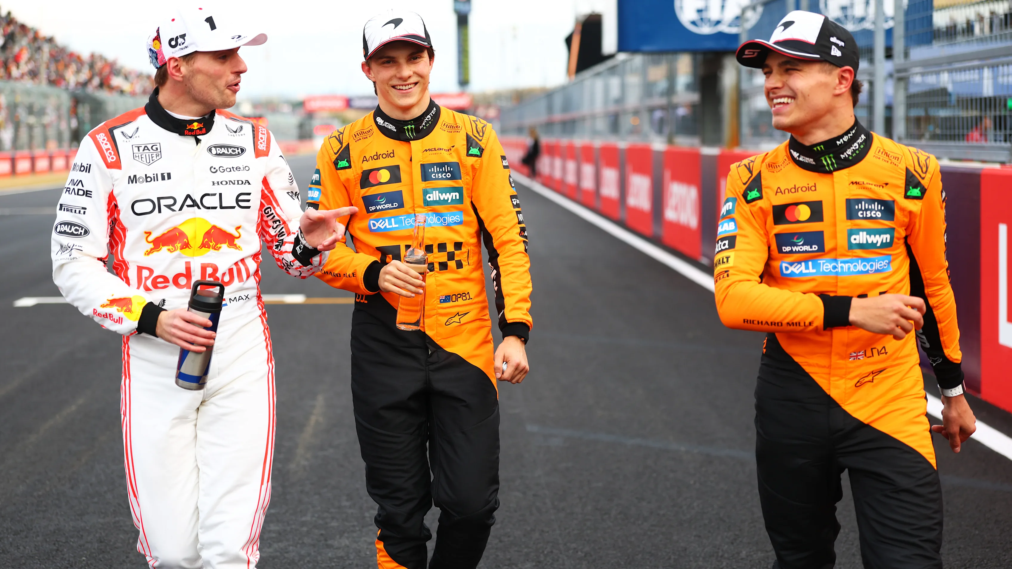 Max Verstappen, Oscar Piastri and Lando Norris talk in parc ferme during qualifying ahead of the F1 Grand Prix of Japan at Suzuka Circuit on April 05, 2025 in Suzuka, Japan. (Photo by Bryn Lennon - Formula 1/Formula 1 via Getty Images)