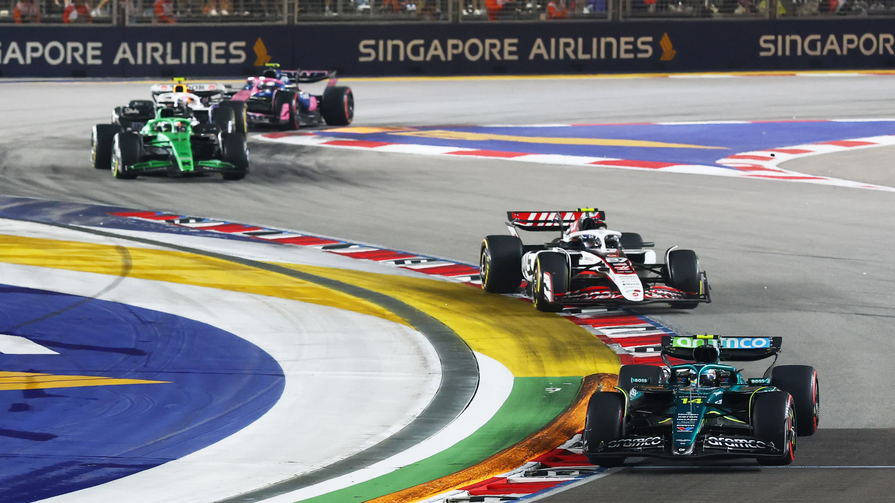 SINGAPORE, SINGAPORE - OCTOBER 05: Fernando Alonso of Spain driving the (14) Aston Martin F1 Team