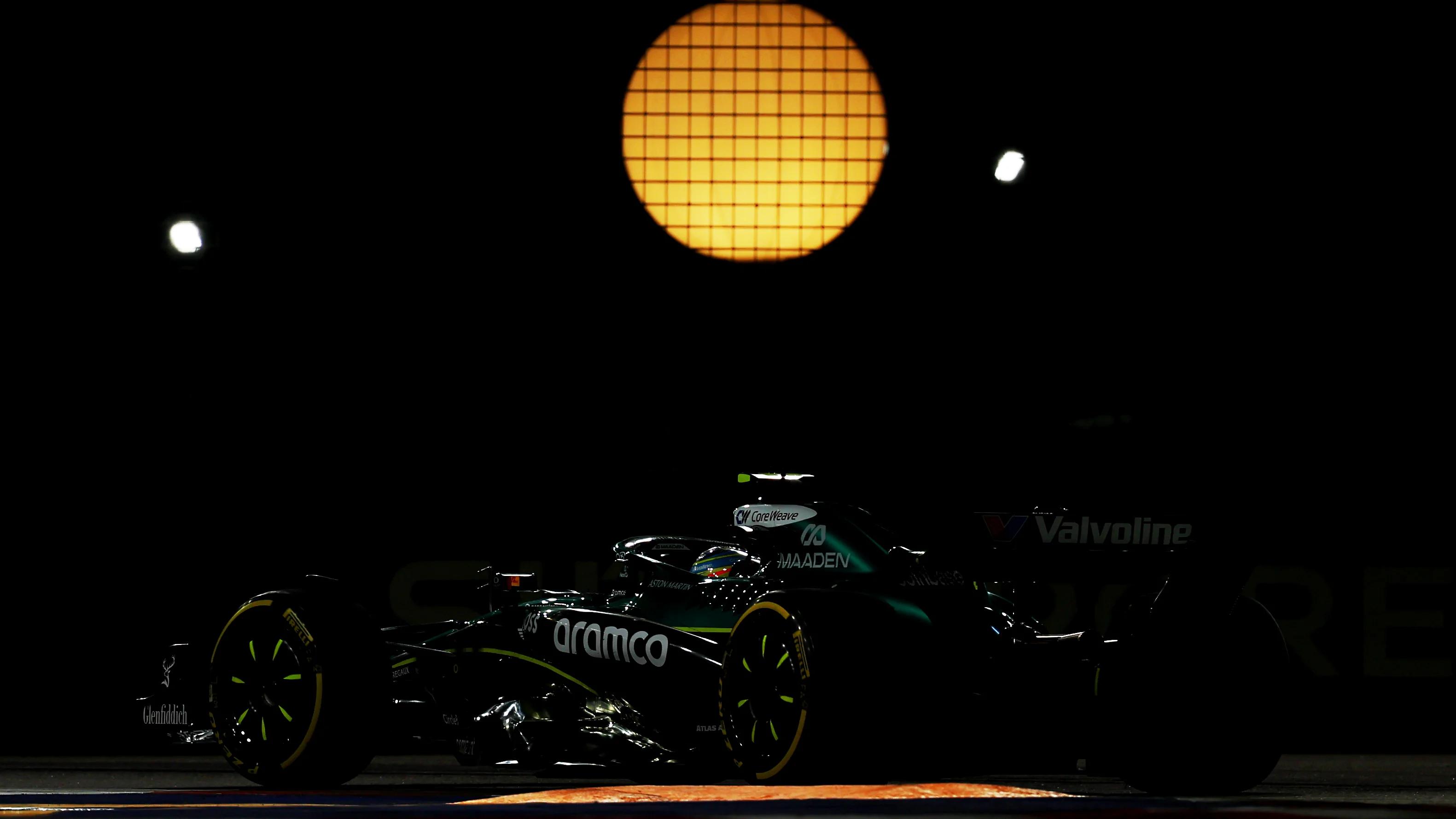 SINGAPORE, SINGAPORE - OCTOBER 05: Fernando Alonso of Spain driving the (14) Aston Martin F1 Team AMR25 Mercedes on track during the F1 Grand Prix of Singapore at Marina Bay Street Circuit on October 05, 2025 in Singapore, Singapore. (Photo by Clive Rose - Formula 1/Formula 1 via Getty Images)