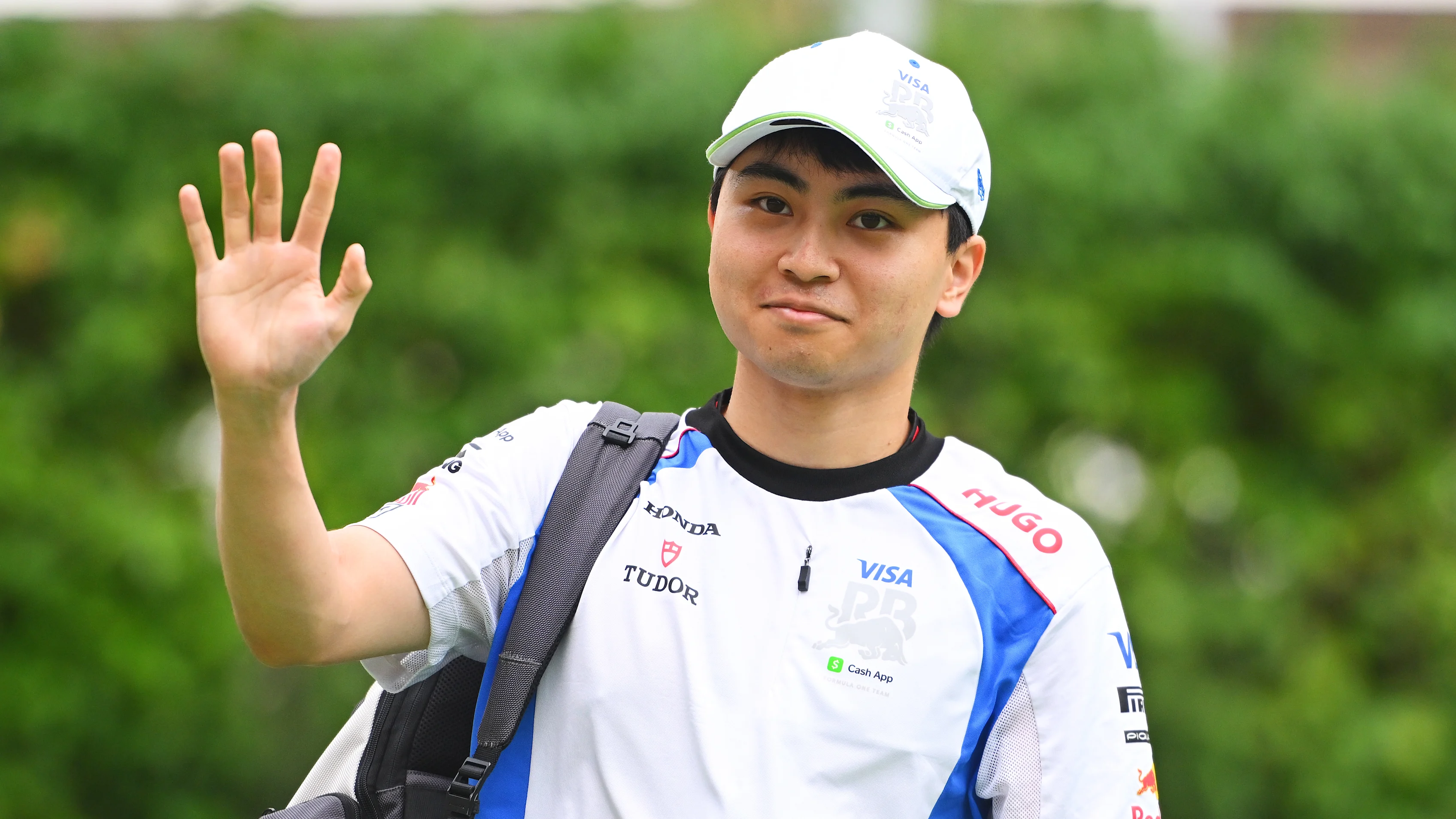 SINGAPORE, SINGAPORE - OCTOBER 03: Ayumu Iwasa of Japan and Visa Cash App Racing Bulls walks in the