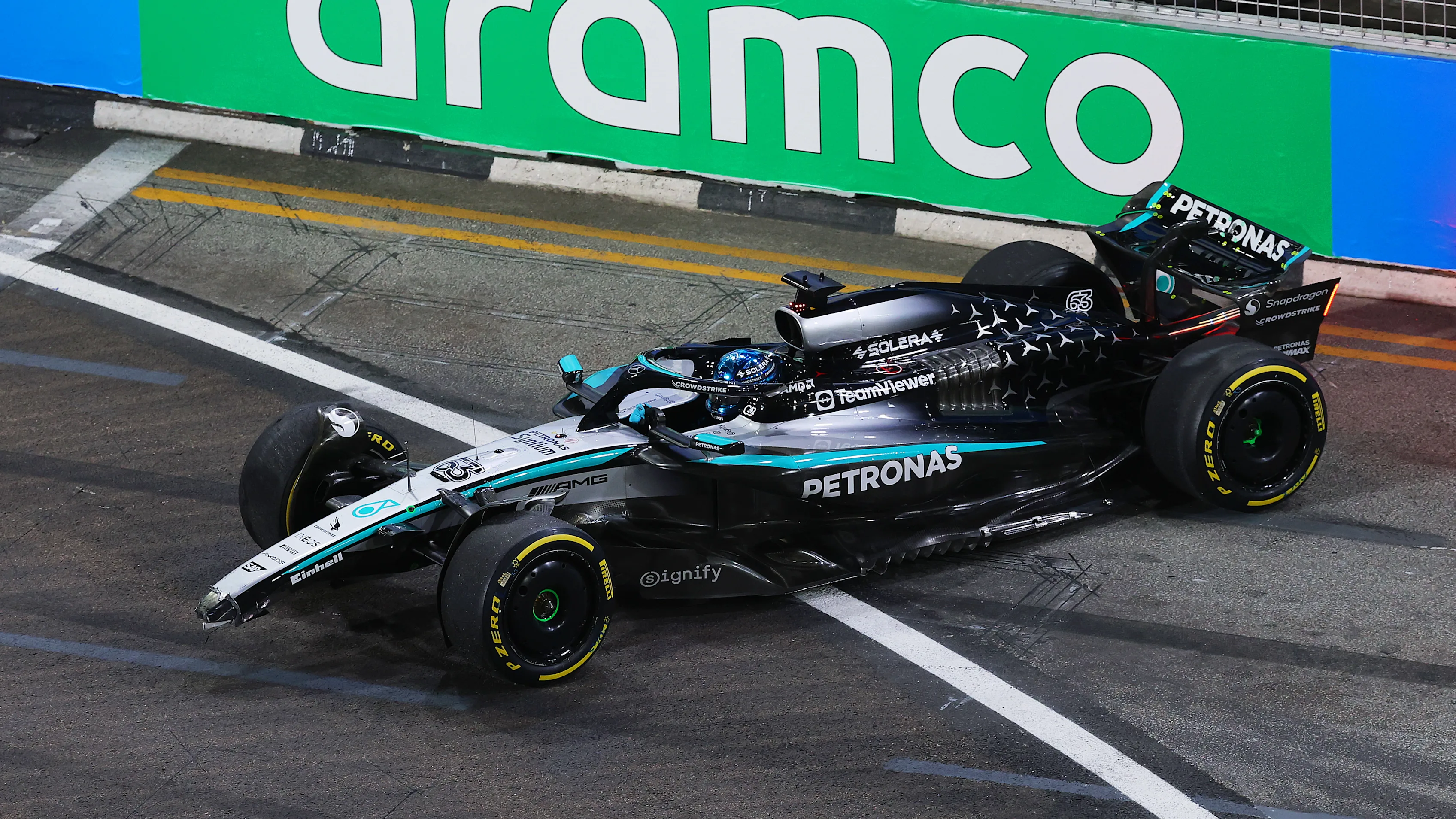 SINGAPORE, SINGAPORE - OCTOBER 03: George Russell of Great Britain driving the (63) Mercedes AMG Petronas F1 Team W16 crashes and damages his front wing during practice ahead of the F1 Grand Prix of Singapore at Marina Bay Street Circuit on October 03, 2025 in Singapore, Singapore. (Photo by Clive Rose - Formula 1/Formula 1 via Getty Images)
