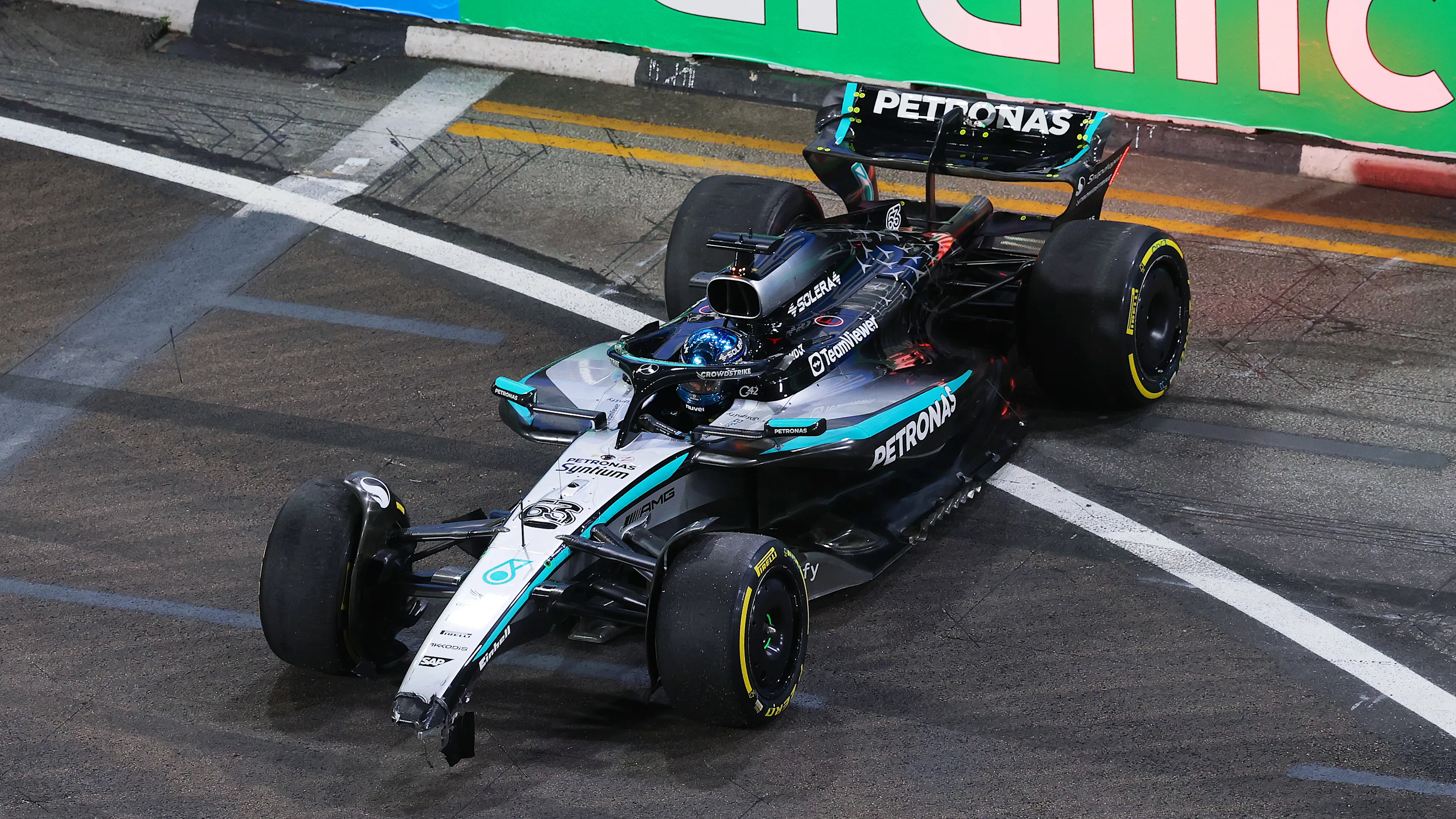 SINGAPORE, SINGAPORE - OCTOBER 03: George Russell of Great Britain driving the (63) Mercedes AMG