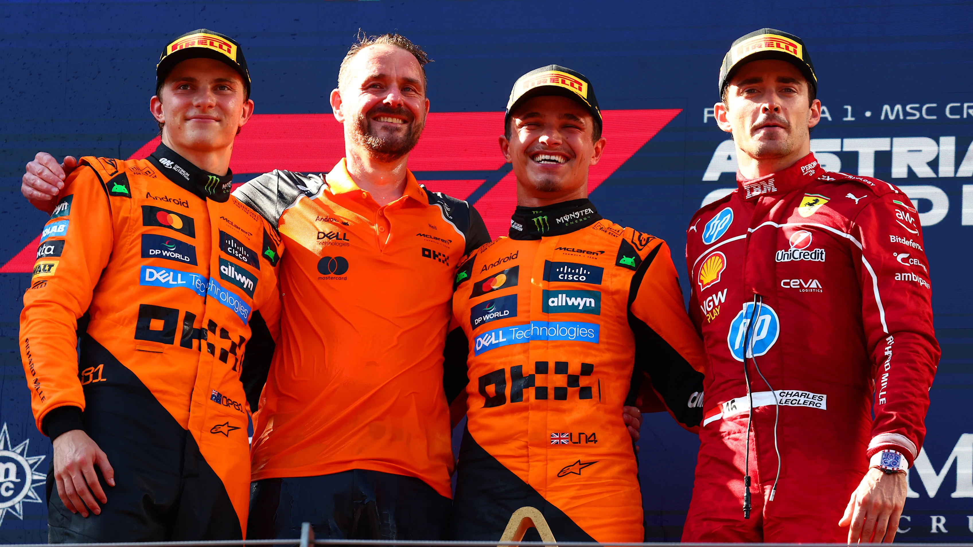 SPIELBERG, AUSTRIA - JUNE 29: Race winner Lando Norris of Great Britain and McLaren Second placed Oscar Piastri of Australia and McLaren Third placed Charles Leclerc of Monaco and Scuderia Ferrari and Neil Houldley, Technical Director of Engineering at McLaren on the podium during the F1 Grand Prix of Austria at Red Bull Ring on June 29, 2025 in Spielberg, Austria. (Photo by Joe Portlock/Getty Images)