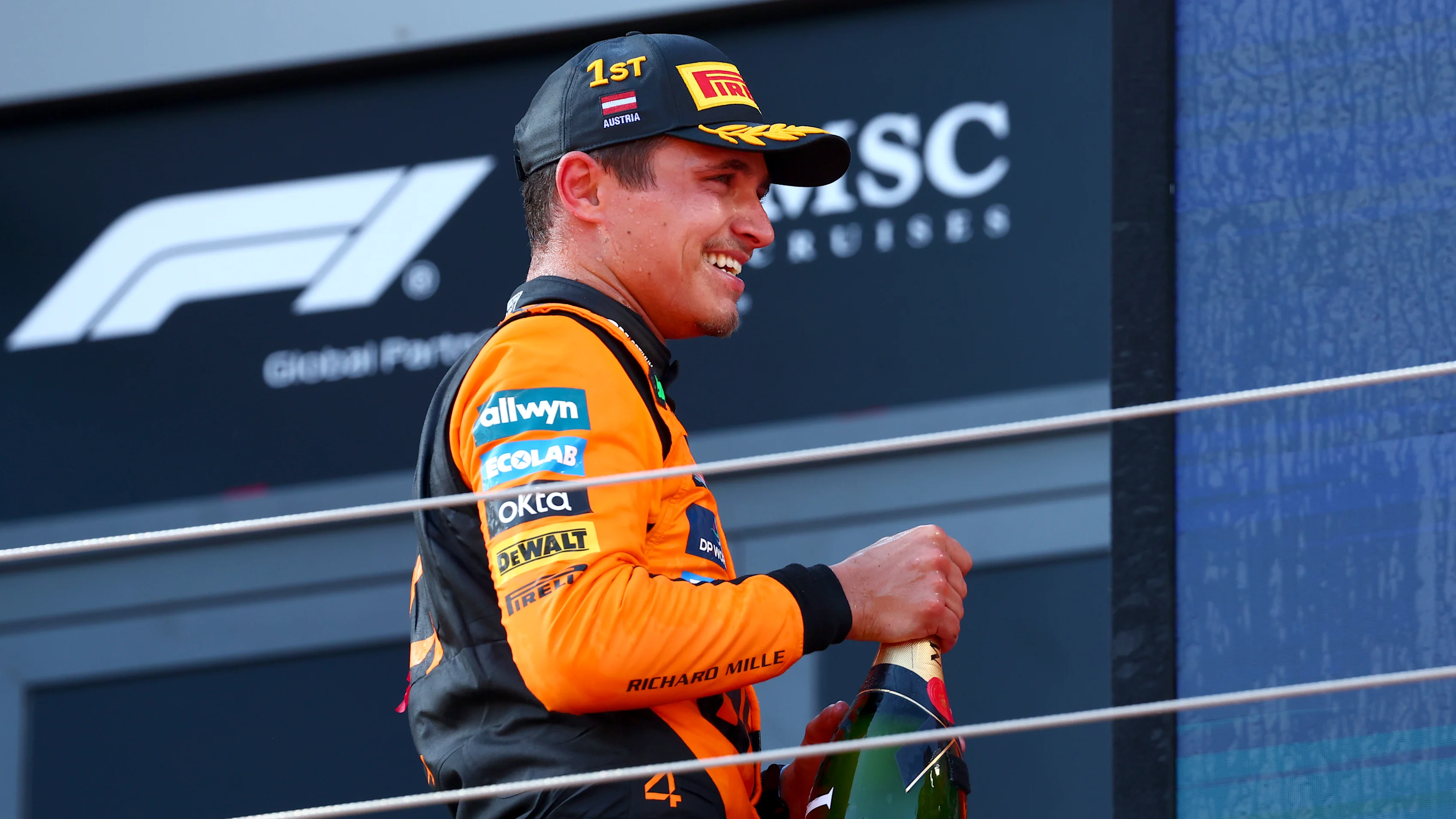 SPIELBERG, AUSTRIA - JUNE 29: Race winner Lando Norris of Great Britain and McLaren celebrates on the podium during the F1 Grand Prix of Austria at Red Bull Ring on June 29, 2025 in Spielberg, Austria. (Photo by Joe Portlock/Getty Images)