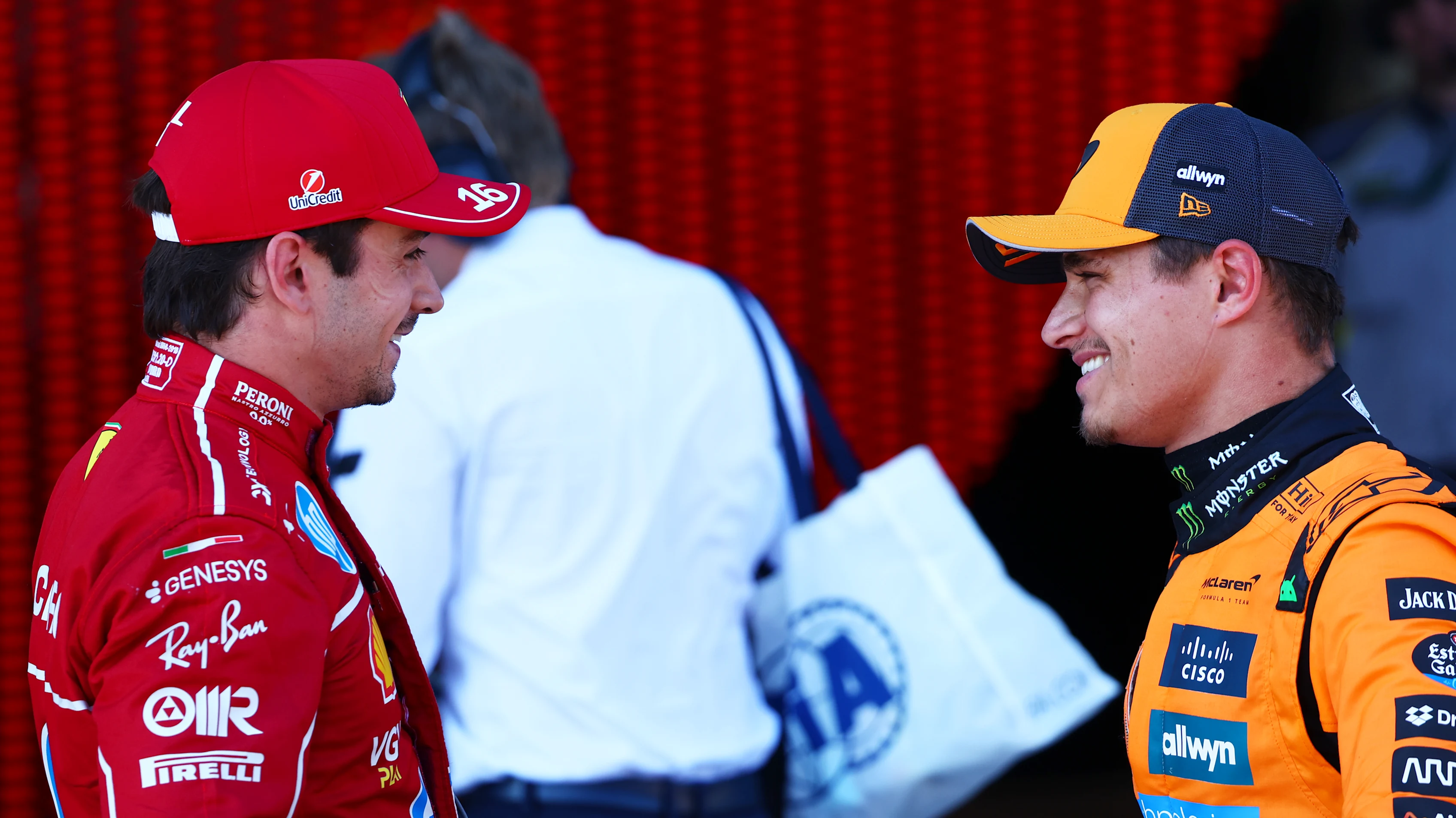 SPIELBERG, AUSTRIA - JUNE 28: Pole position qualifier Lando Norris of Great Britain and McLaren and Second placed qualifier Charles Leclerc of Monaco and Scuderia Ferrari talk in parc ferme during qualifying ahead of the F1 Grand Prix of Austria at Red Bull Ring on June 28, 2025 in Spielberg, Austria. (Photo by Joe Portlock/Getty Images)