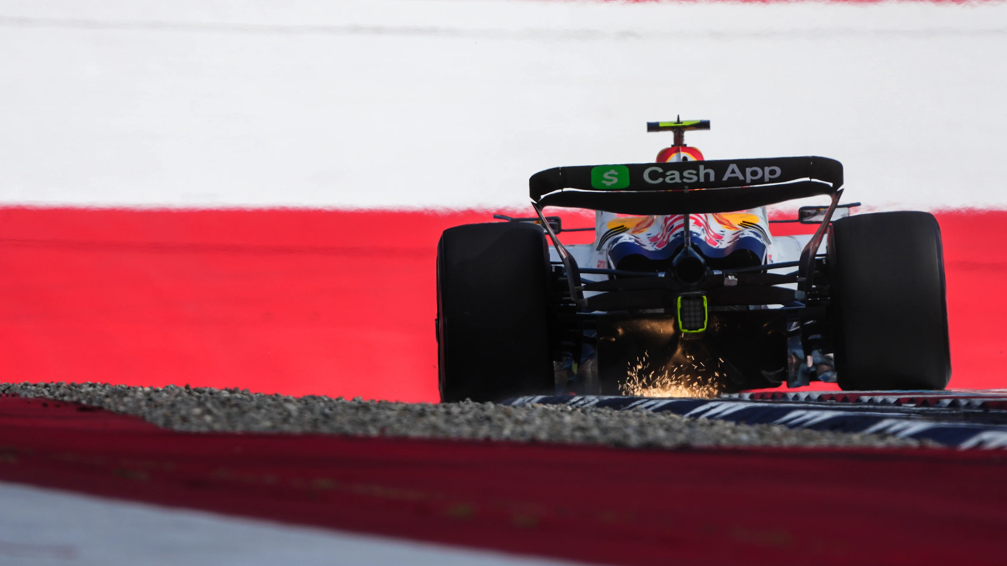 SPIELBERG, AUSTRIA - JUNE 28: Sparks fly behind Liam Lawson of New Zealand driving the (30) Visa Cash App Racing Bulls VCARB 02 on track during qualifying ahead of the F1 Grand Prix of Austria at Red Bull Ring on June 28, 2025 in Spielberg, Austria. (Photo by Malcolm Griffiths - Formula 1/Formula 1 via Getty Images)