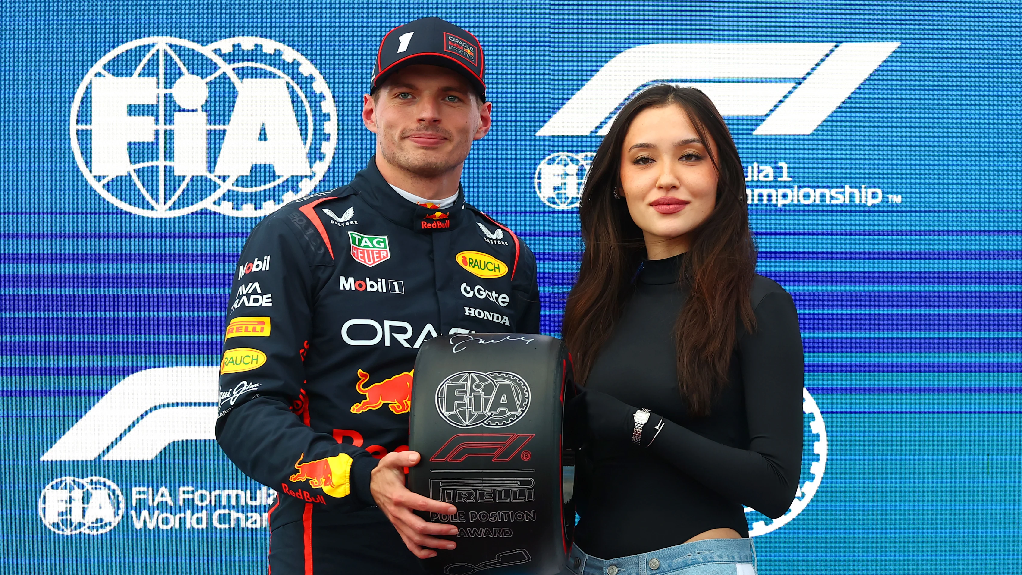 BAKU, AZERBAIJAN - SEPTEMBER 20: Janelle Zharmenova presents Pole position qualifier Max Verstappen