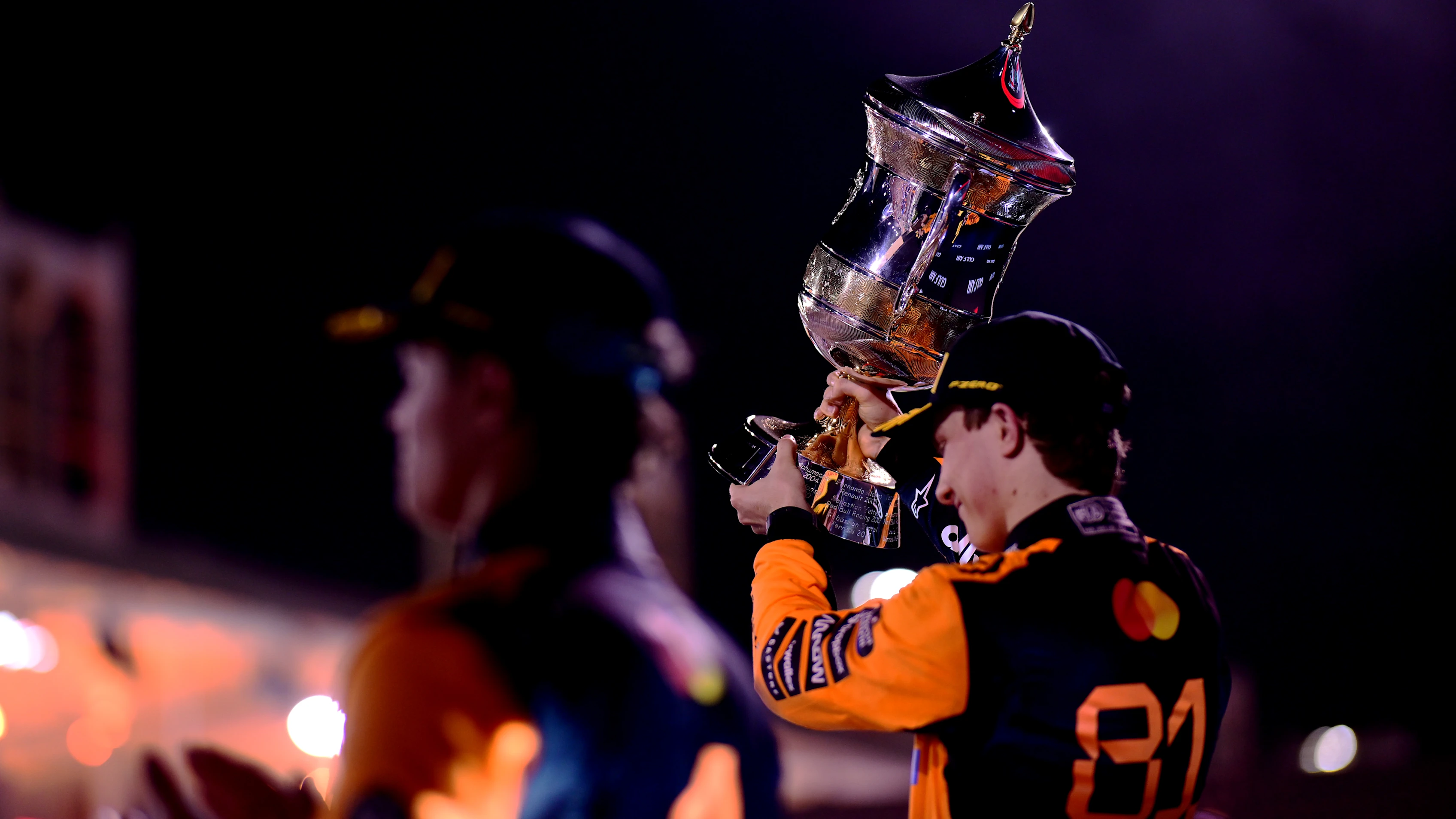 BAHRAIN, BAHRAIN - APRIL 13: Race winner Oscar Piastri of Australia and McLaren lifts the winners