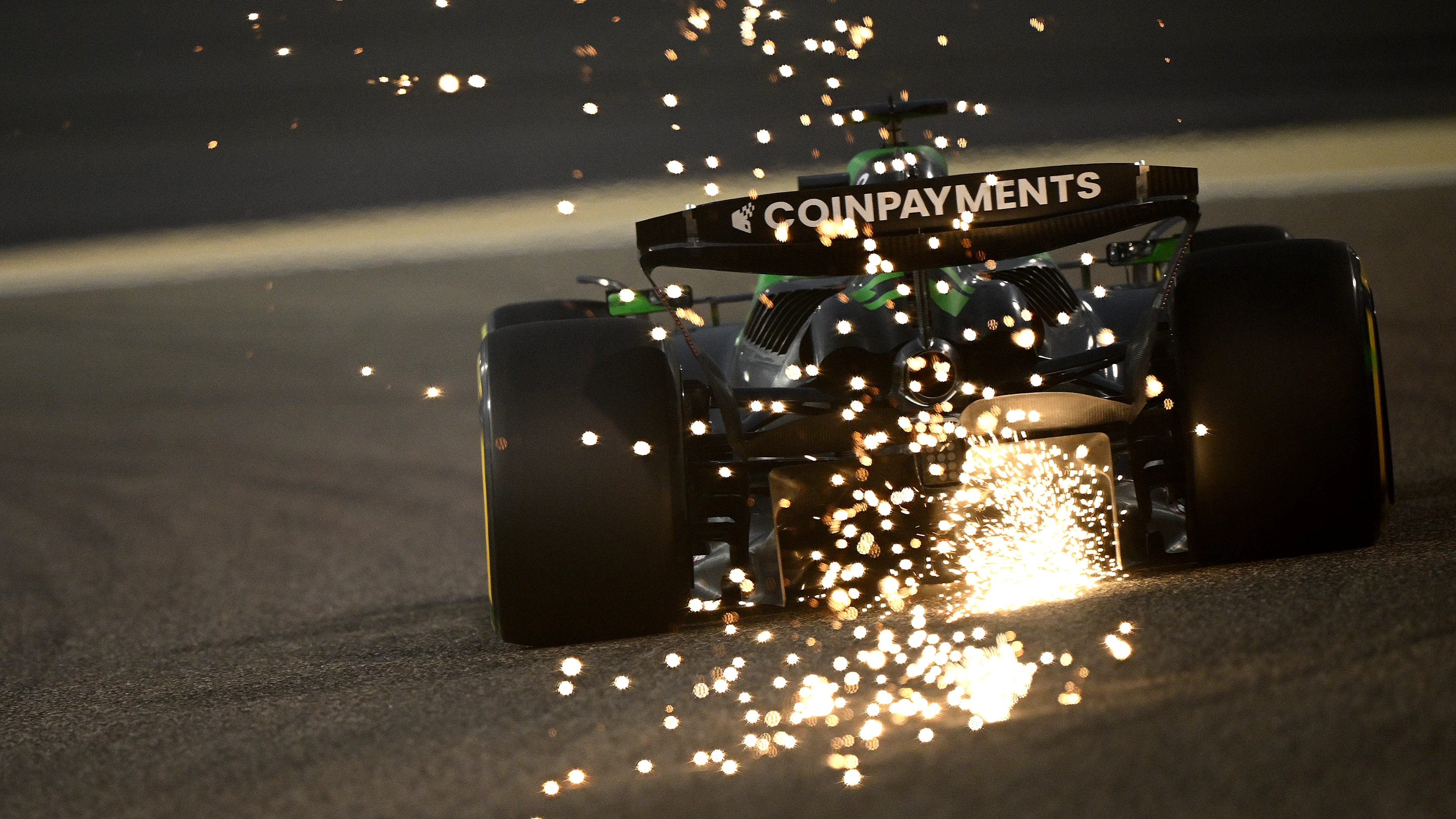 BAHRAIN, BAHRAIN - APRIL 11: Sparks fly behind Nico Hulkenberg of Germany driving the (27) Kick