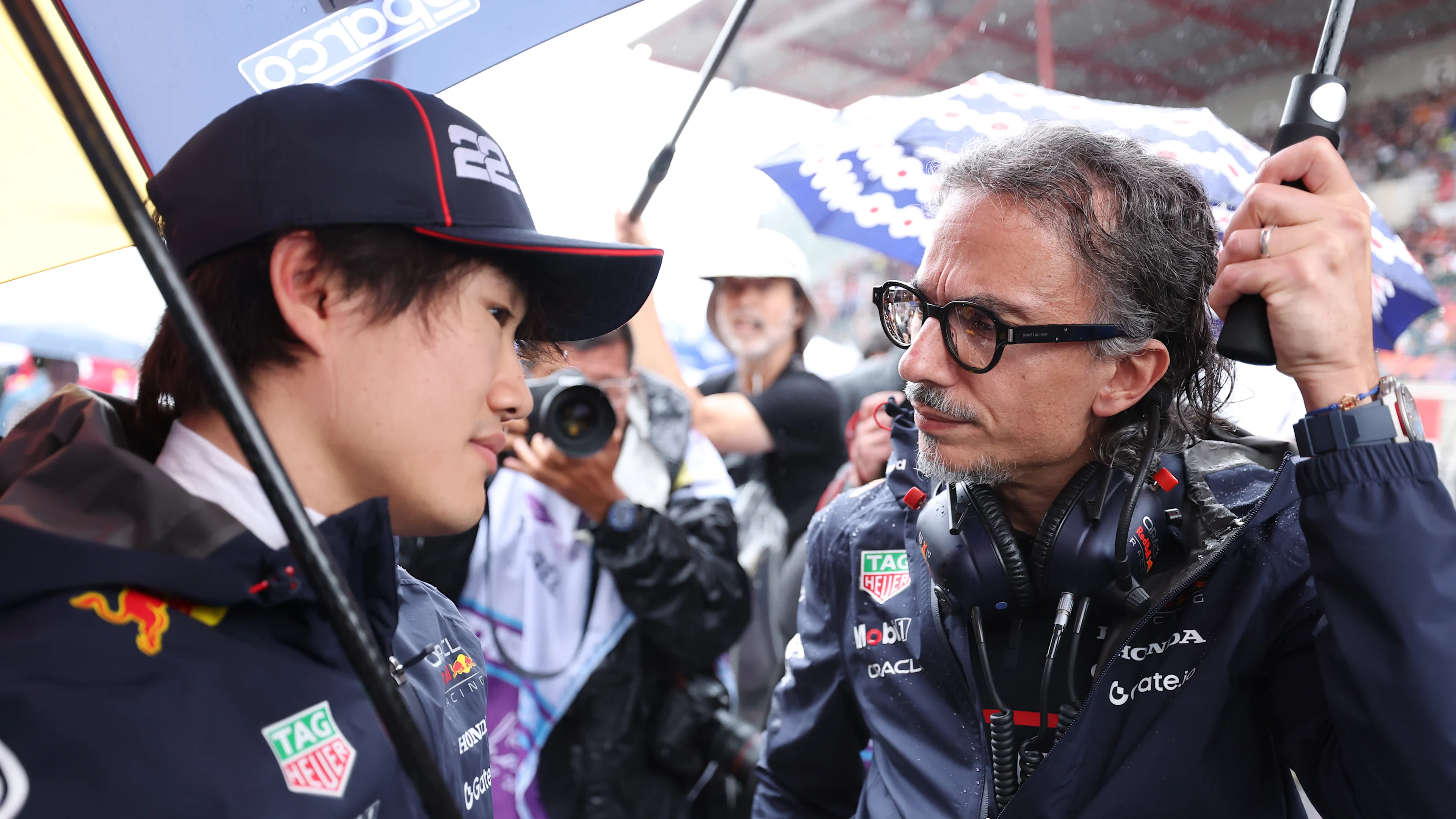 SPA, BELGIUM - JULY 27: Yuki Tsunoda of Japan and Oracle Red Bull Racing talks with Laurent Mekies,