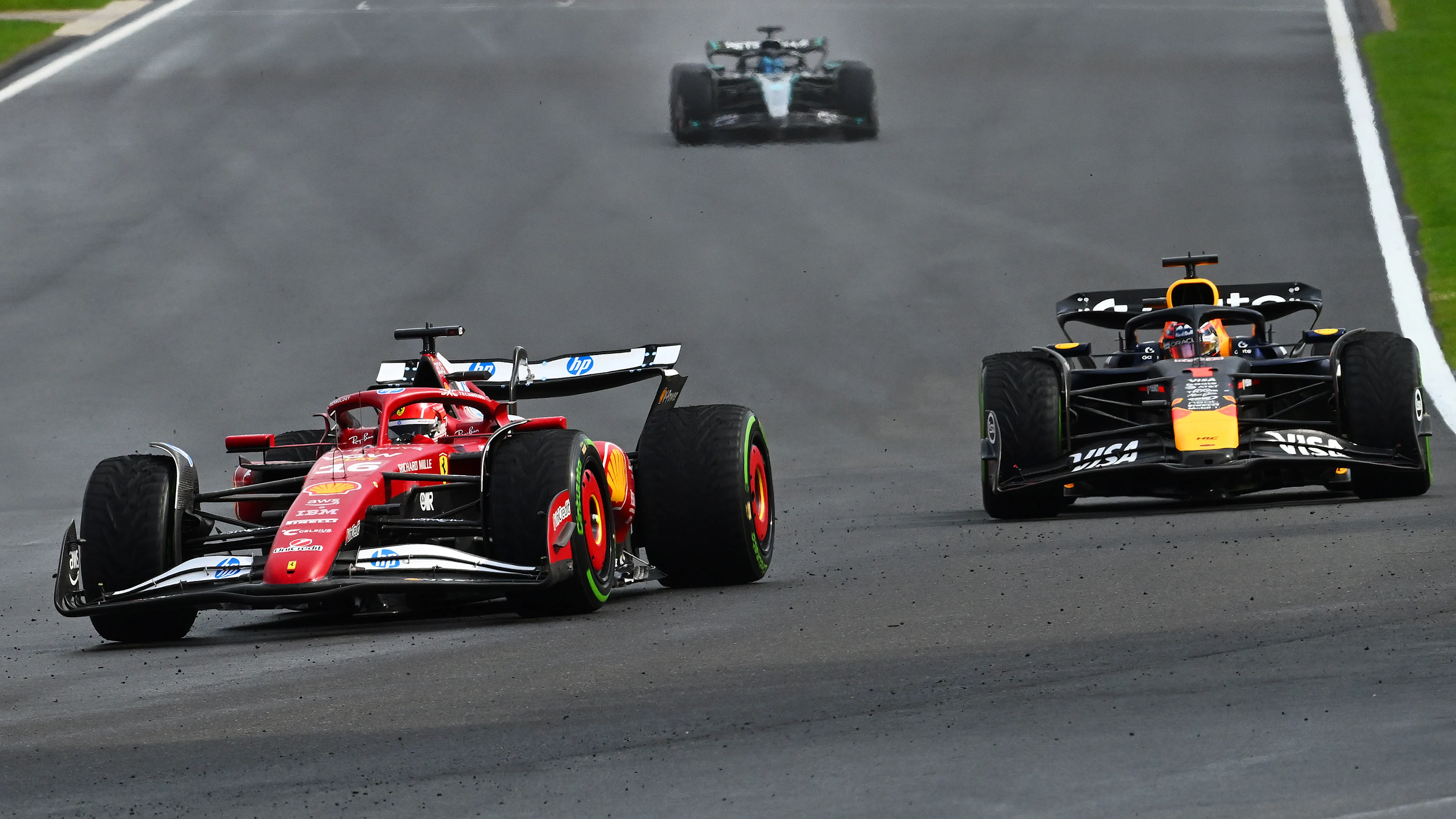 SPA, BELGIUM - JULY 27: Charles Leclerc of Monaco driving the (16) Scuderia Ferrari SF-25 leads Max