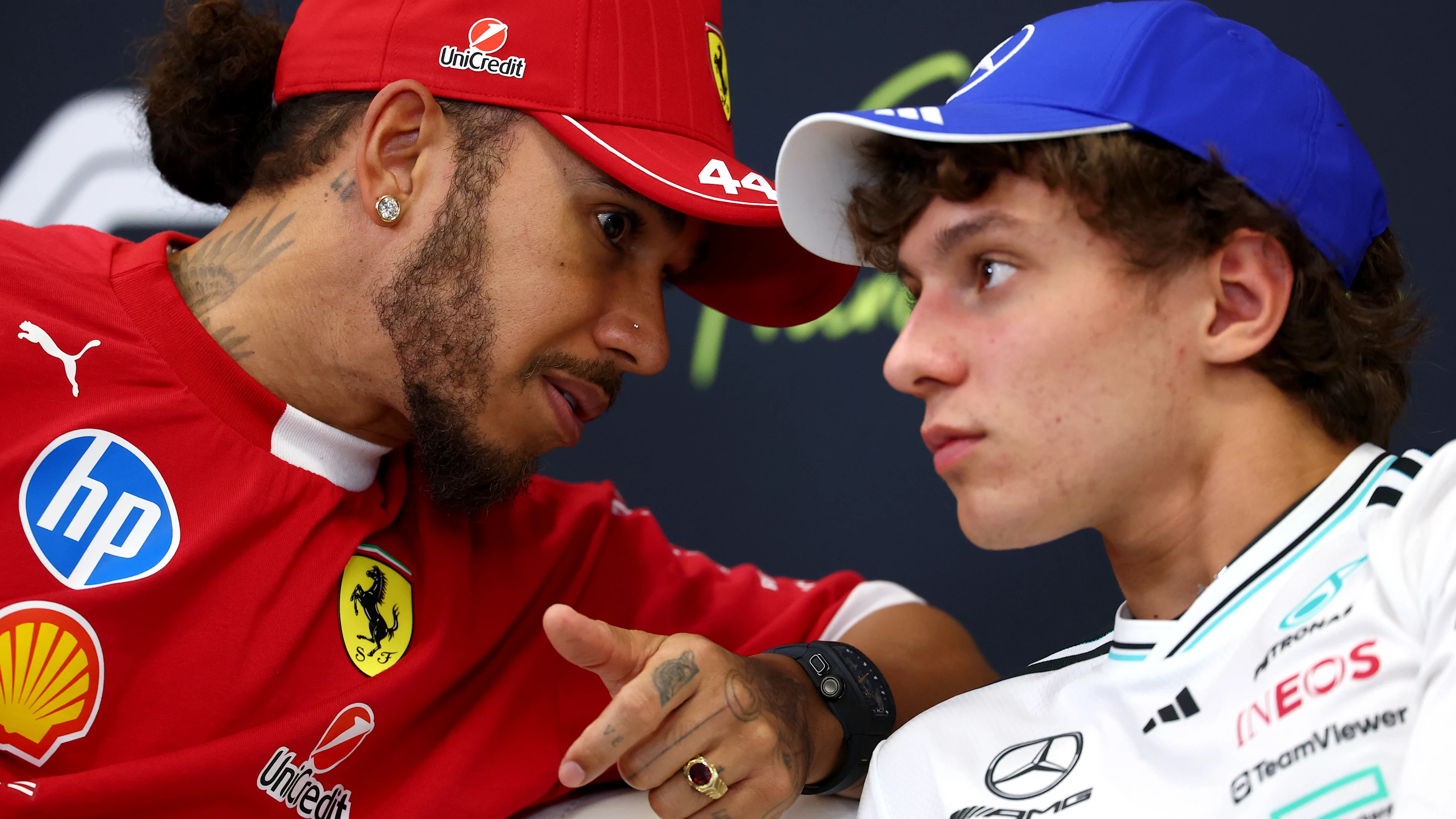 SPA, BELGIUM - JULY 24: Lewis Hamilton of Great Britain and Scuderia Ferrari talks with Andrea Kimi