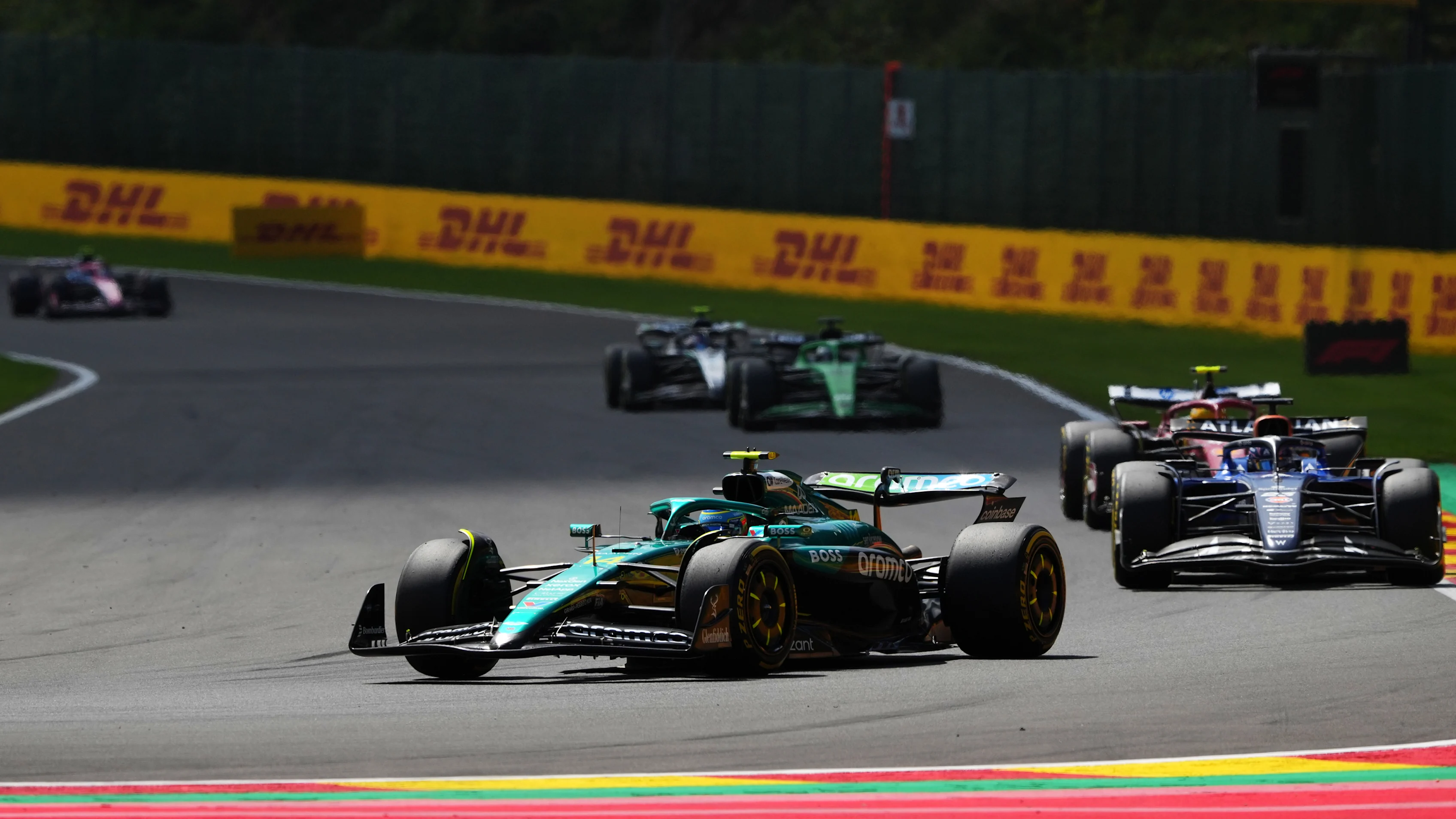 SPA, BELGIUM - JULY 26: Fernando Alonso of Spain driving the (14) Aston Martin F1 Team AMR25 Mercedes leads Alexander Albon of Thailand driving the (23) Williams FW47 Mercedes and Lewis Hamilton of Great Britain driving the (44) Scuderia Ferrari SF-25 on track during the Sprint ahead of the F1 Grand Prix of Belgium at Circuit de Spa-Francorchamps on July 26, 2025 in Spa, Belgium. (Photo by Alex Bierens de Haan/Getty Images)