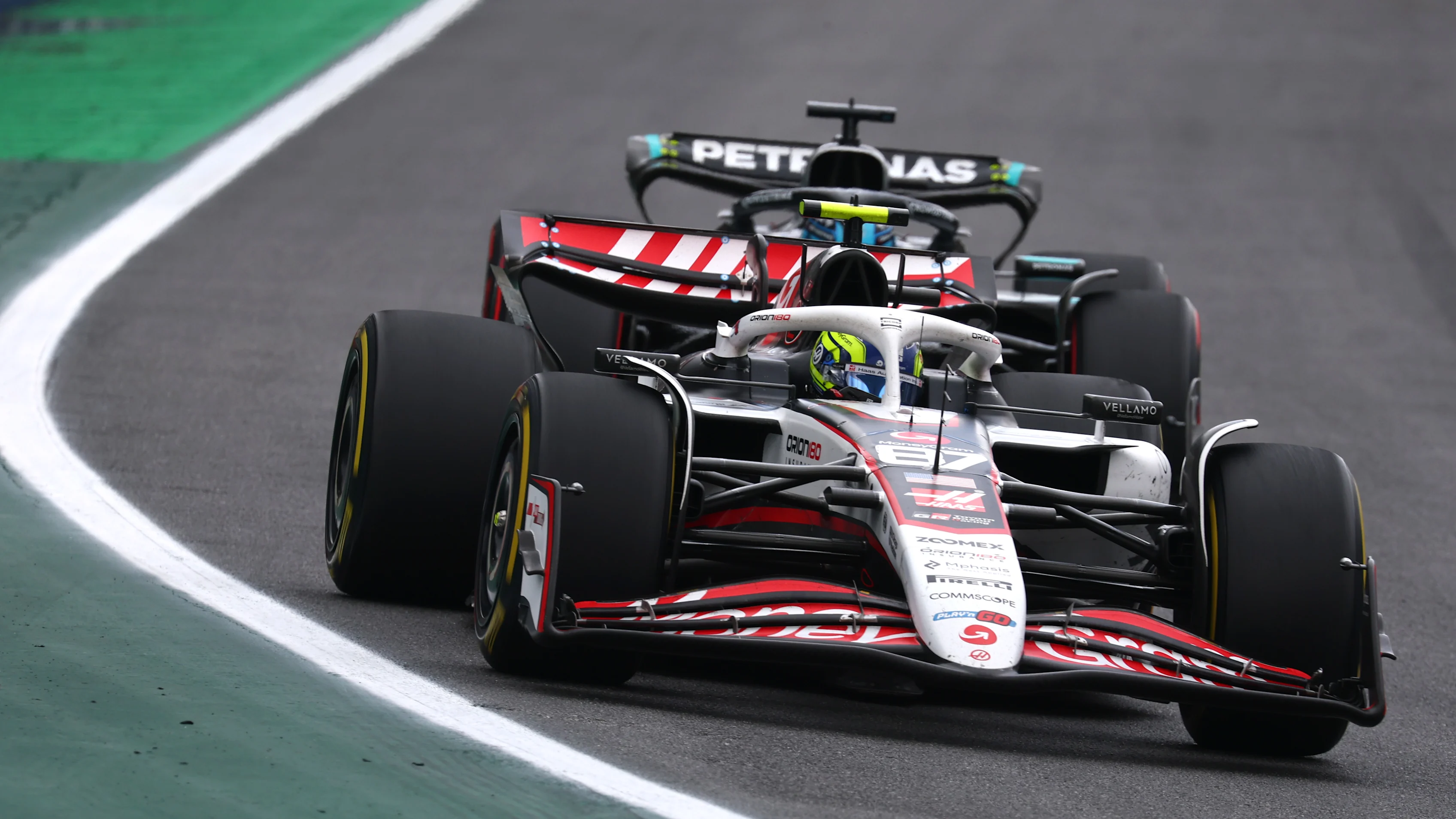 SAO PAULO, BRAZIL - NOVEMBER 09: Oliver Bearman of Great Britain driving the (87) Haas F1 VF-25 Ferrari leads George Russell of Great Britain driving the (63) Mercedes AMG Petronas F1 Team W16 on track during the F1 Grand Prix of Brazil at Autodromo Jose Carlos Pace on November 09, 2025 in Sao Paulo, Brazil. (Photo by Mark Thompson/Getty Images)