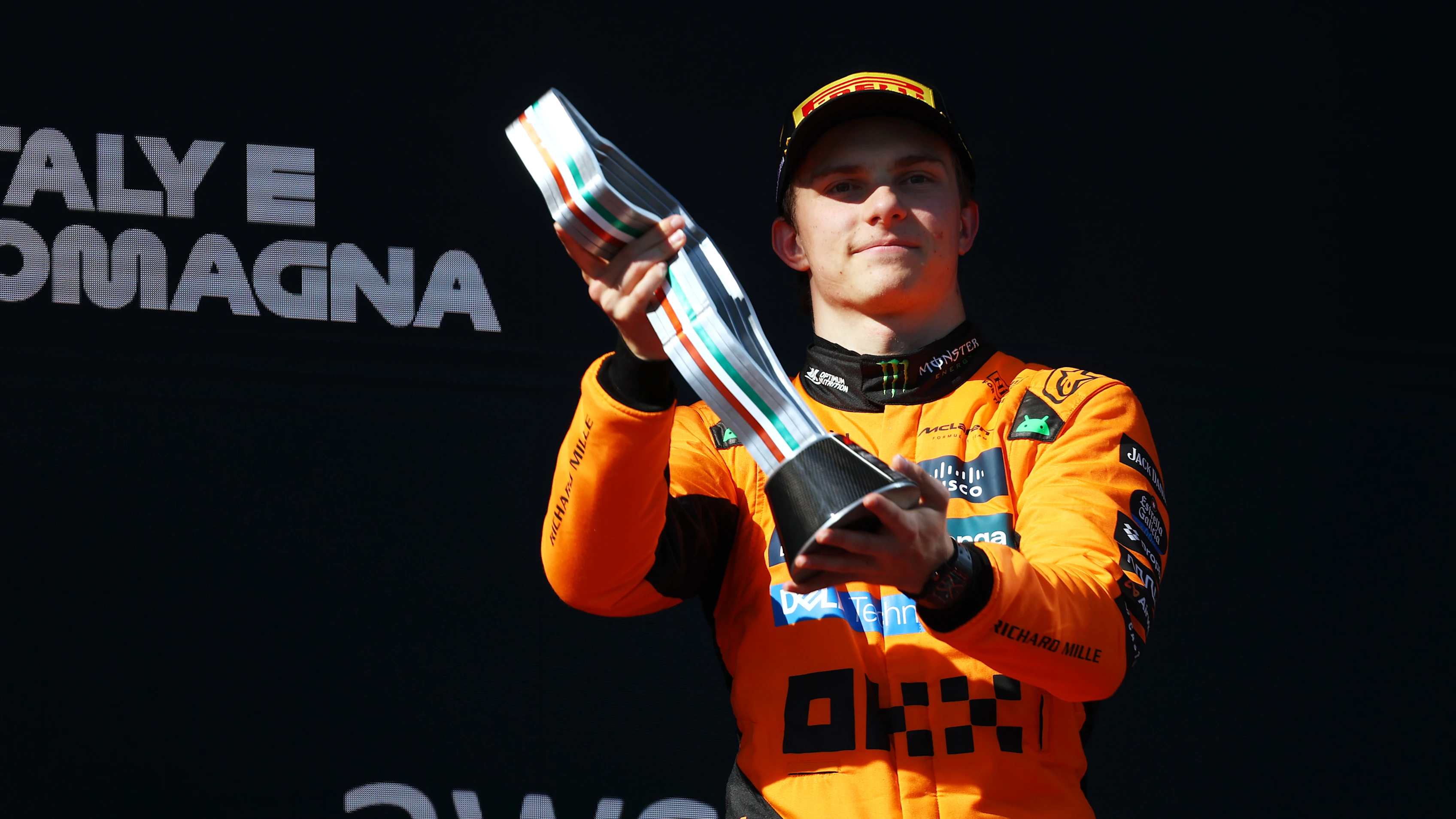IMOLA, ITALY - MAY 18: Third placed Oscar Piastri of Australia and McLaren lifts his trophy on the