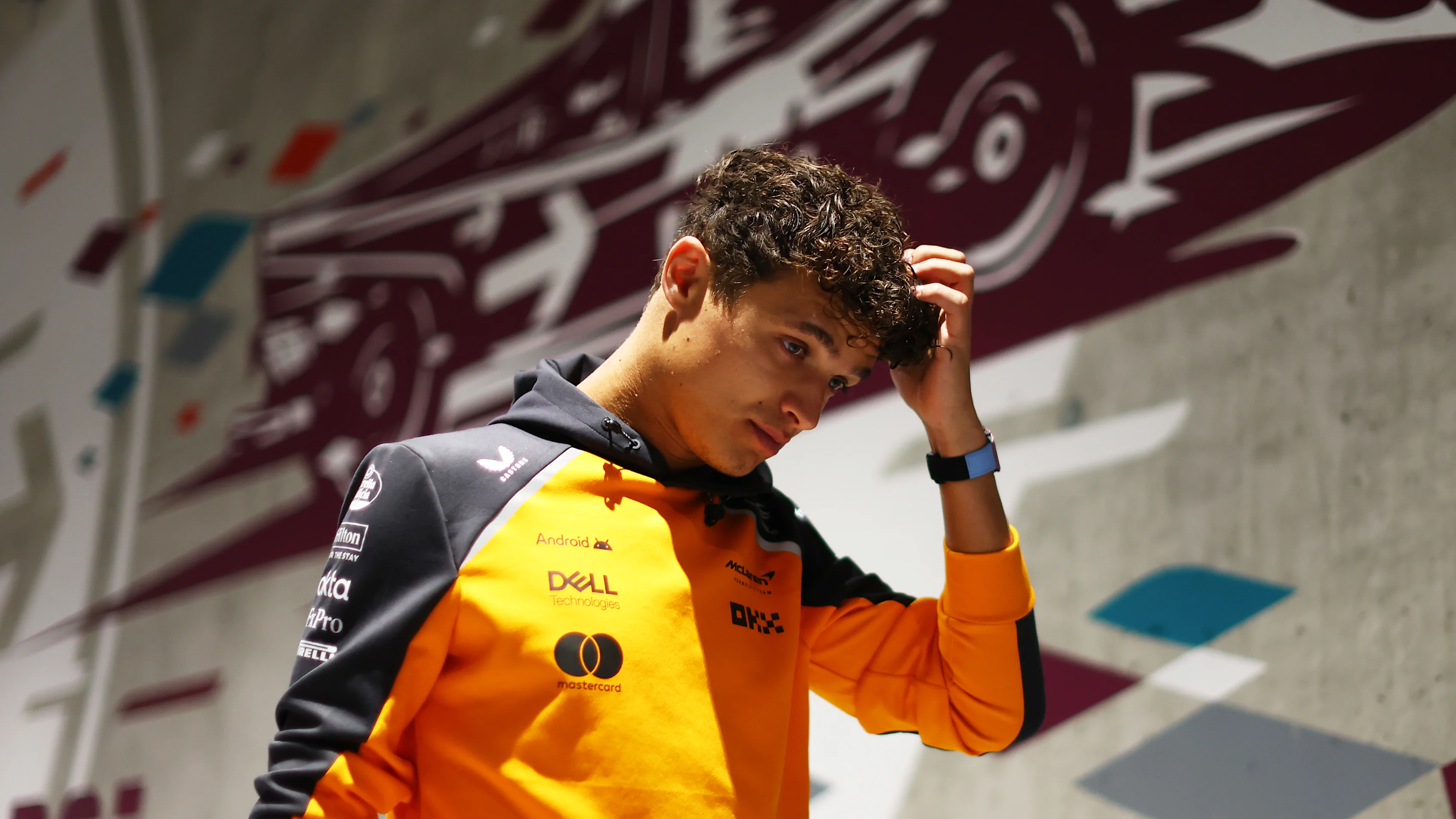 BUDAPEST, HUNGARY - AUGUST 01: Lando Norris of Great Britain and McLaren arrives in the Paddock