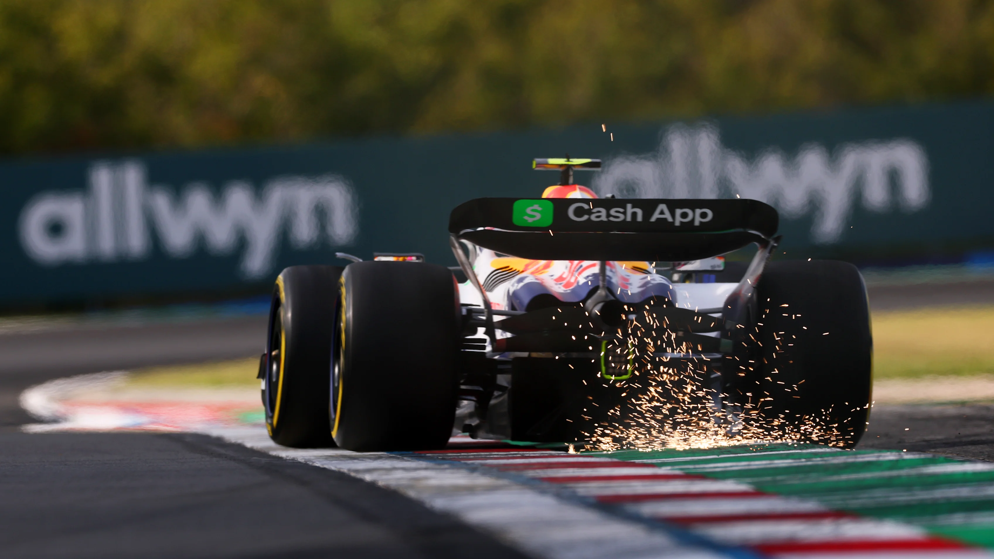 BUDAPEST, HUNGARY - AUGUST 01: Sparks fly behind Liam Lawson of New Zealand driving the (30) Visa