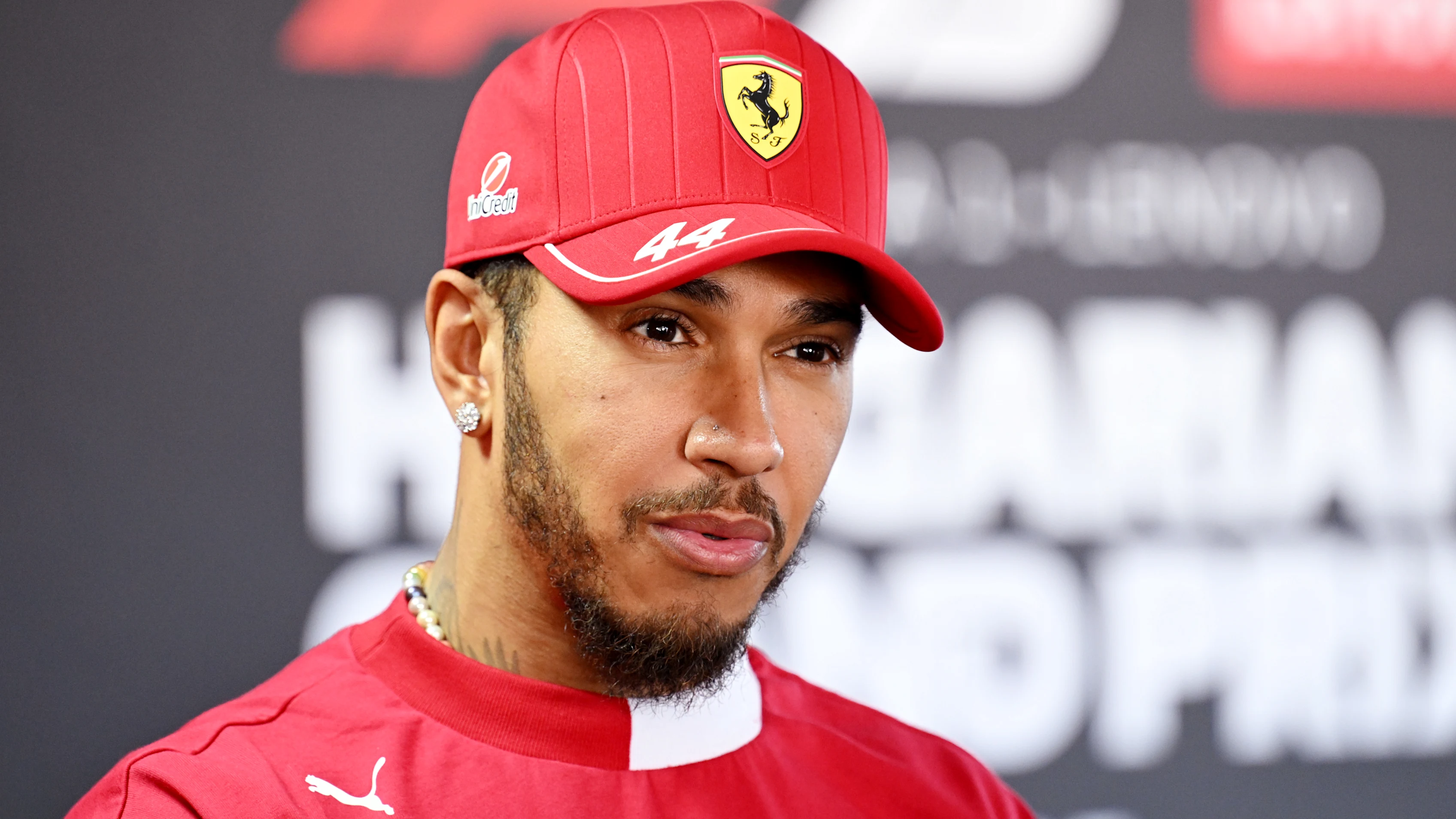 BUDAPEST, HUNGARY - JULY 31: Lewis Hamilton of Great Britain and Scuderia Ferrari talks to the