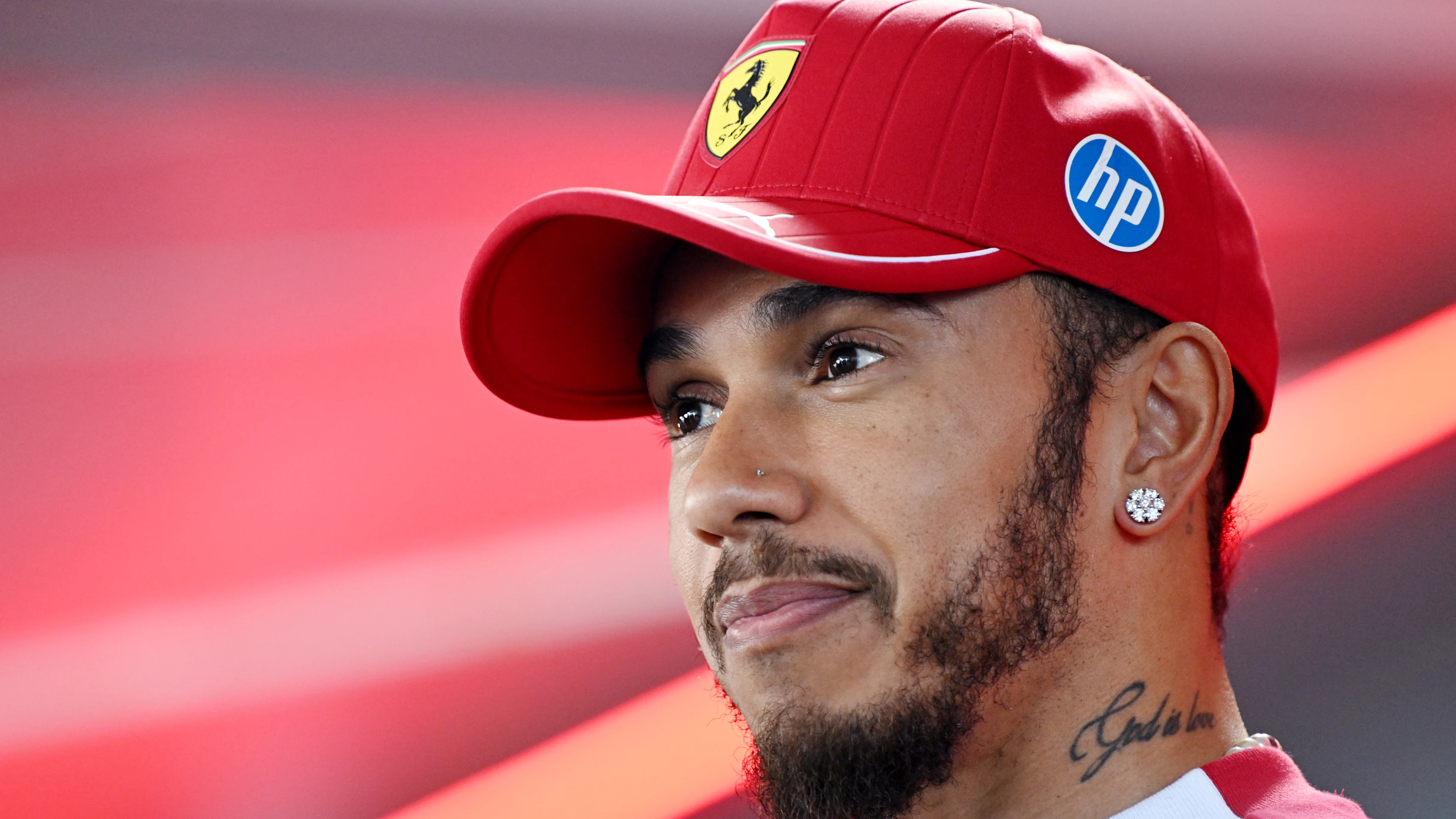 BUDAPEST, HUNGARY - JULY 31: Lewis Hamilton of Great Britain and Scuderia Ferrari talks to the