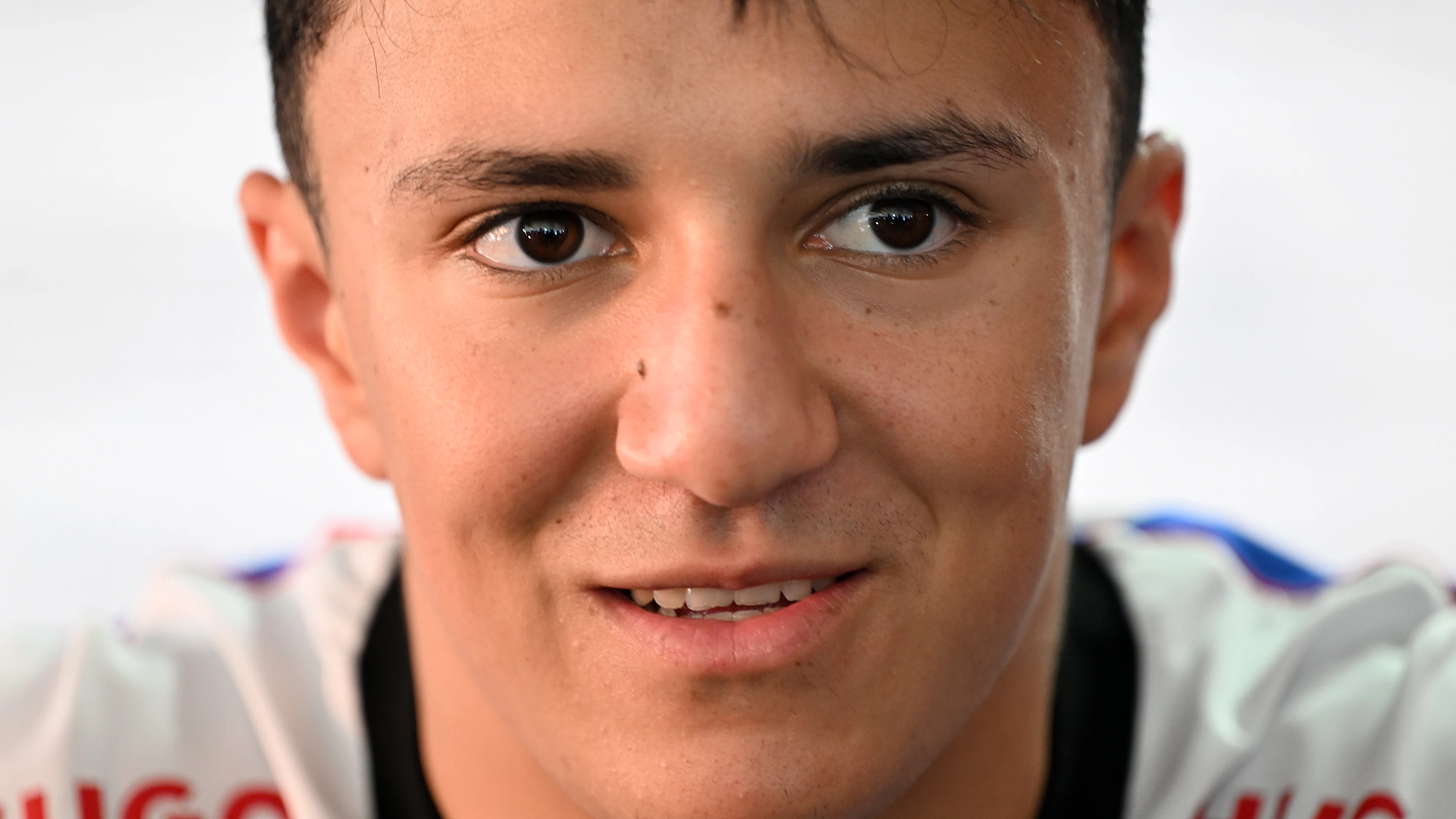 MONZA, ITALY - SEPTEMBER 04: Isack Hadjar of France and Visa Cash App Racing Bulls talks to the