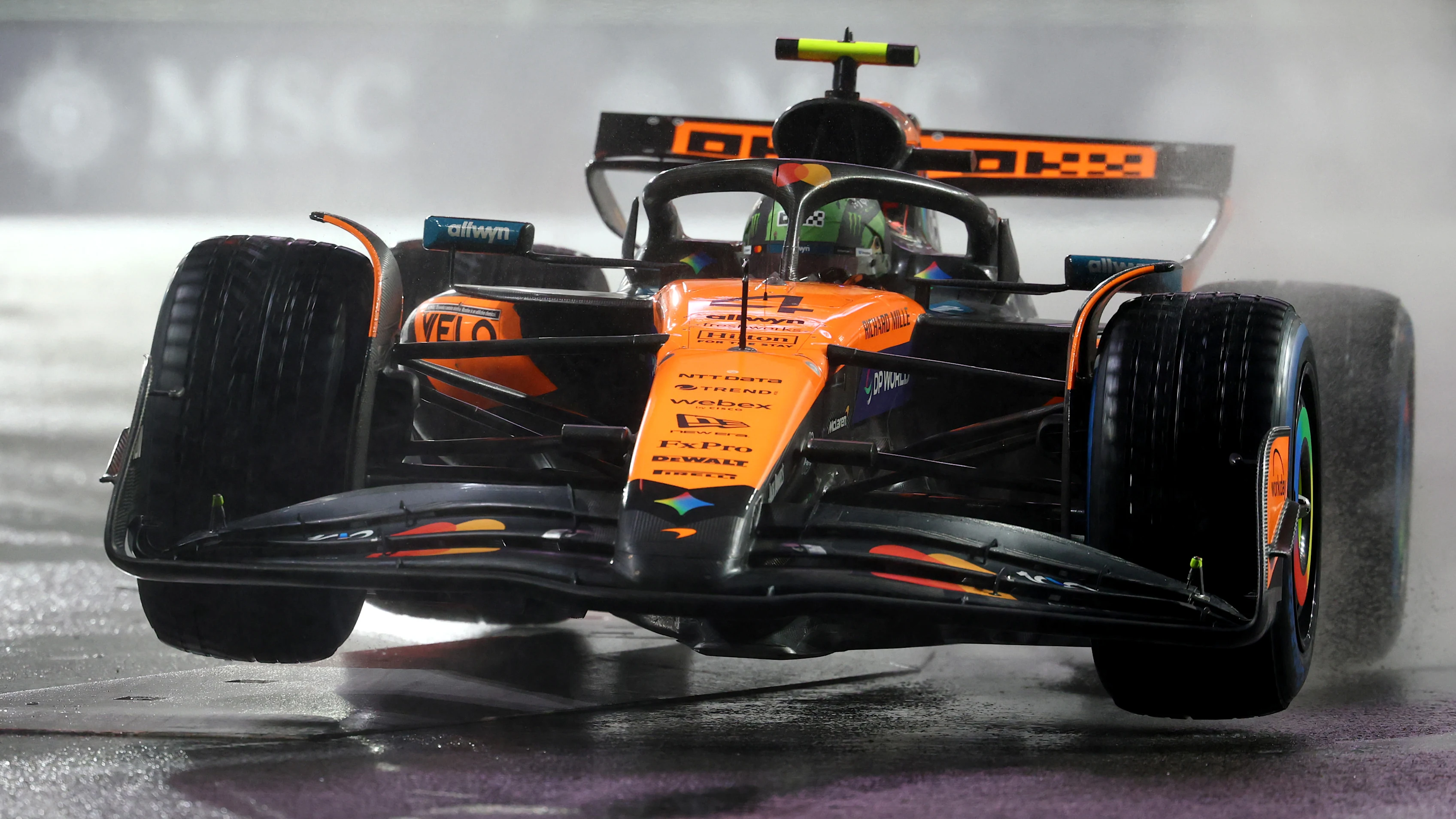 LAS VEGAS, NEVADA - NOVEMBER 21: Lando Norris of Great Britain driving the (4) McLaren MCL39 Mercedes lifts a wheel on track during qualifying ahead of the F1 Grand Prix of Las Vegas at Las Vegas Strip Circuit on November 21, 2025 in Las Vegas, Nevada. (Photo by Clive Rose/Getty Images)