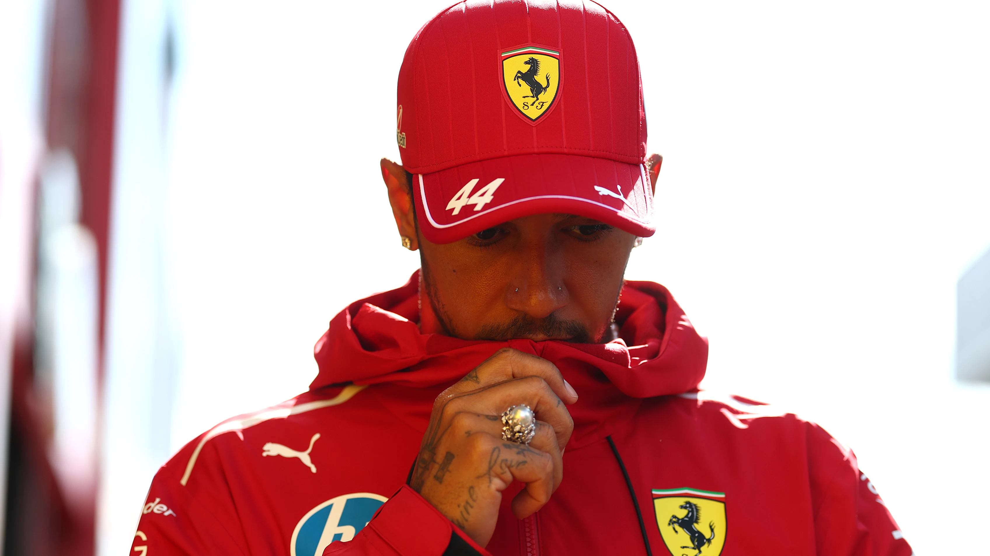 ZANDVOORT, NETHERLANDS - AUGUST 28: Lewis Hamilton of Great Britain and Scuderia Ferrari walks in